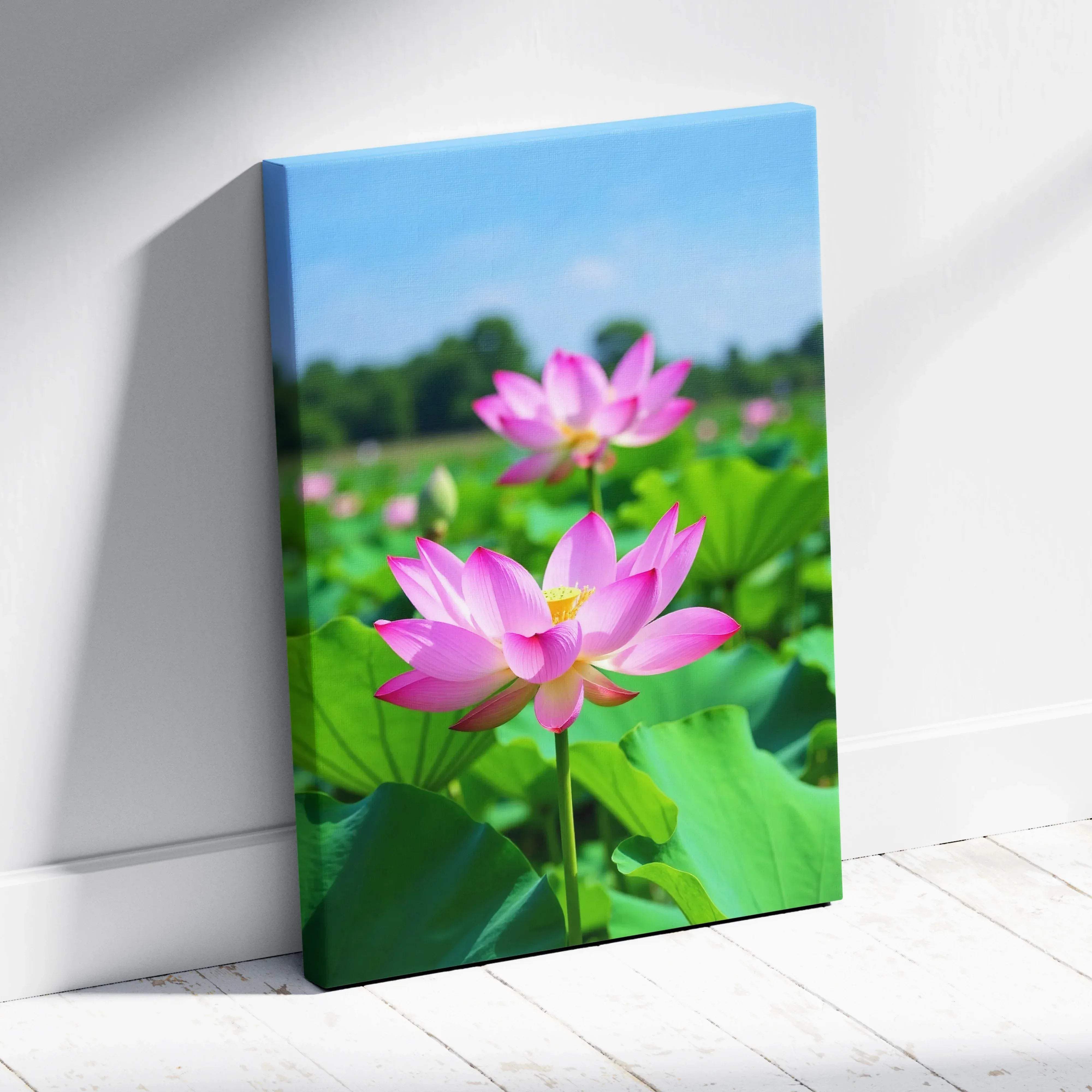 Pink lotus flower canvas wall art with vibrant colors delicate petals yellow center and lush green leaves floral photography