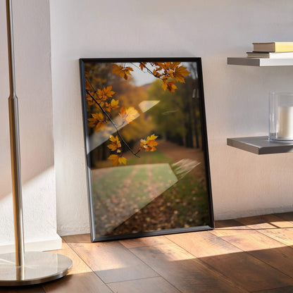 Vertical autumn leaves digital art poster with warm orange and yellow tones leaning on floor.