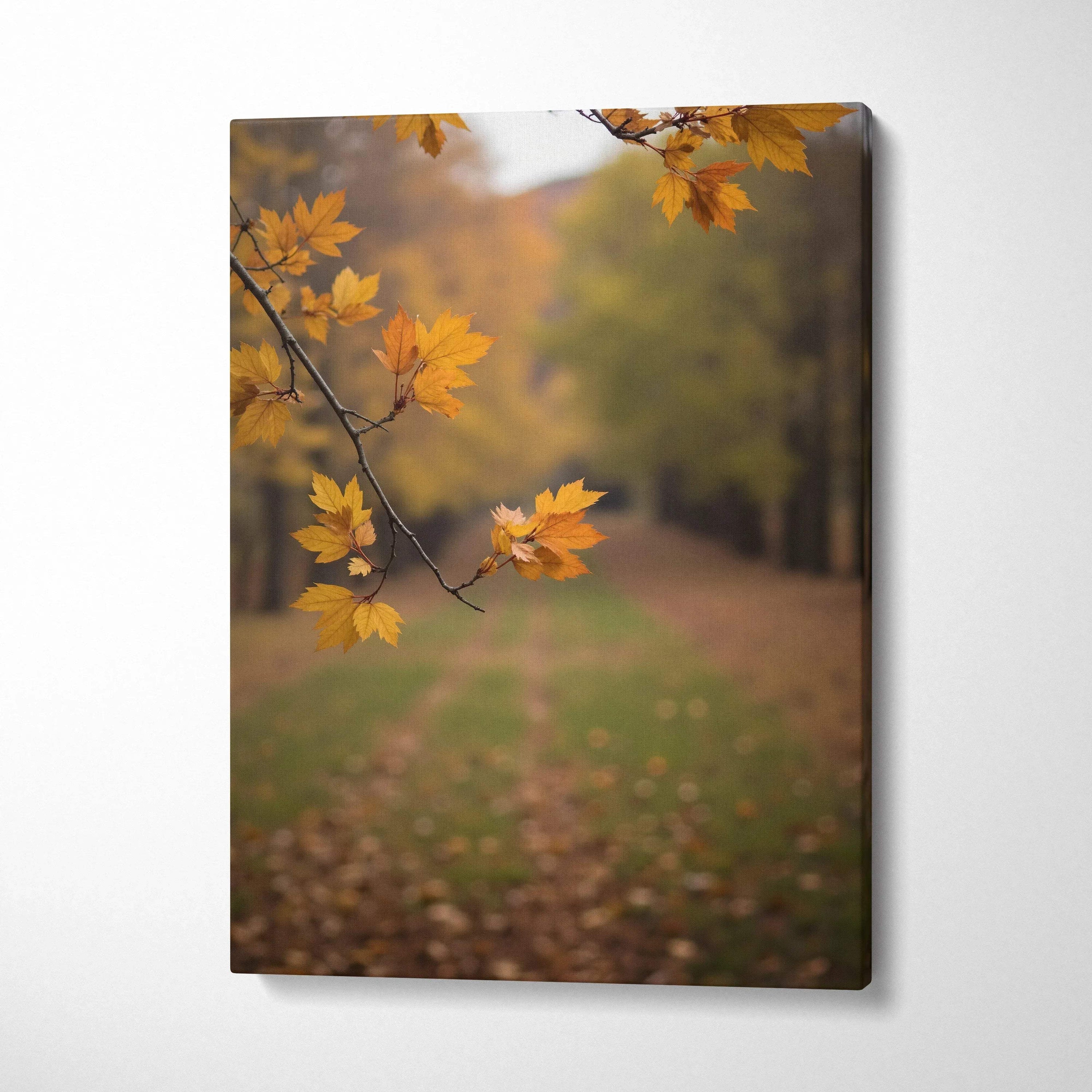 Autumn forest canvas wall art with close-up of golden leaves and blurred woodland path in background.