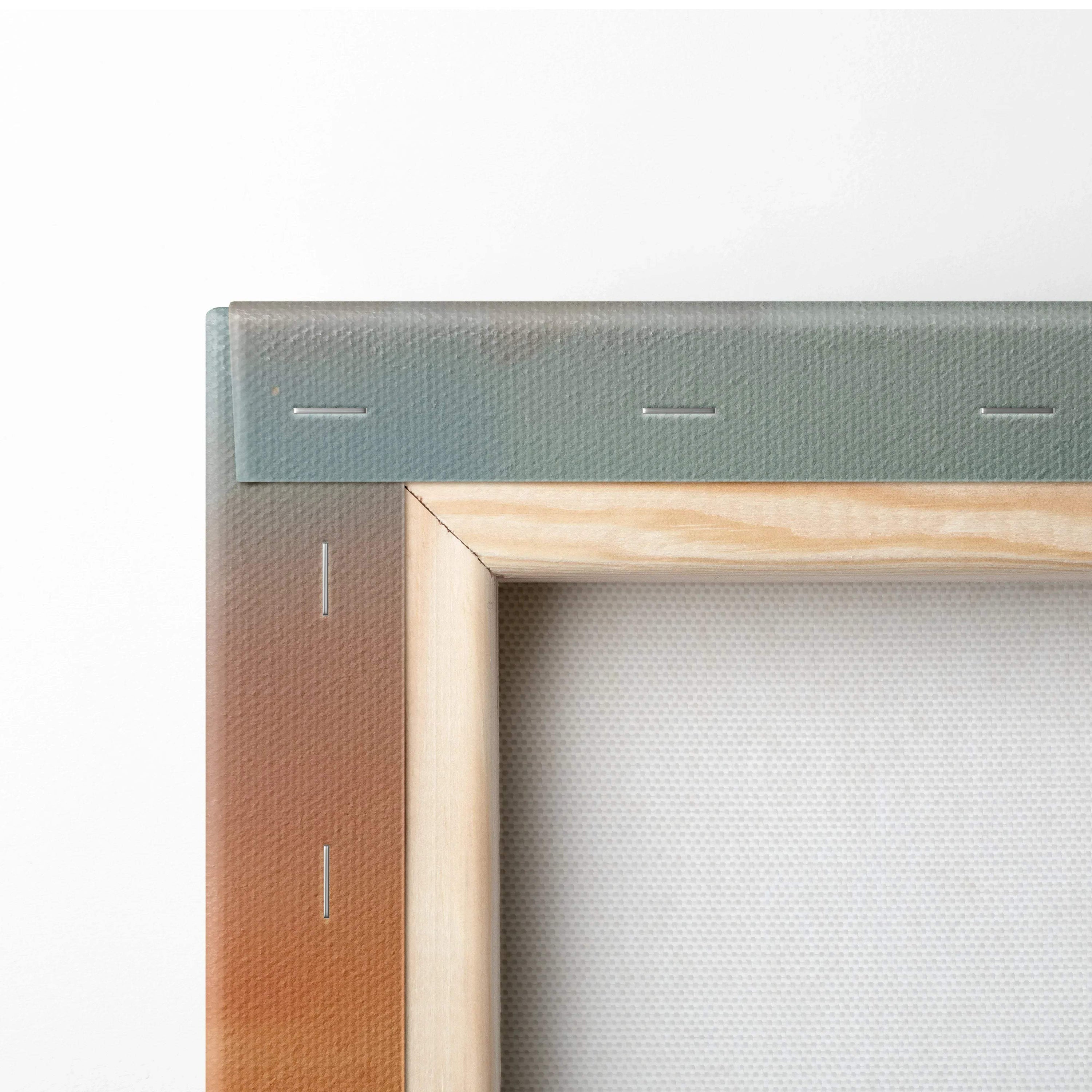 Corner detail of wooden frame with stretched canvas backing for wall art print.