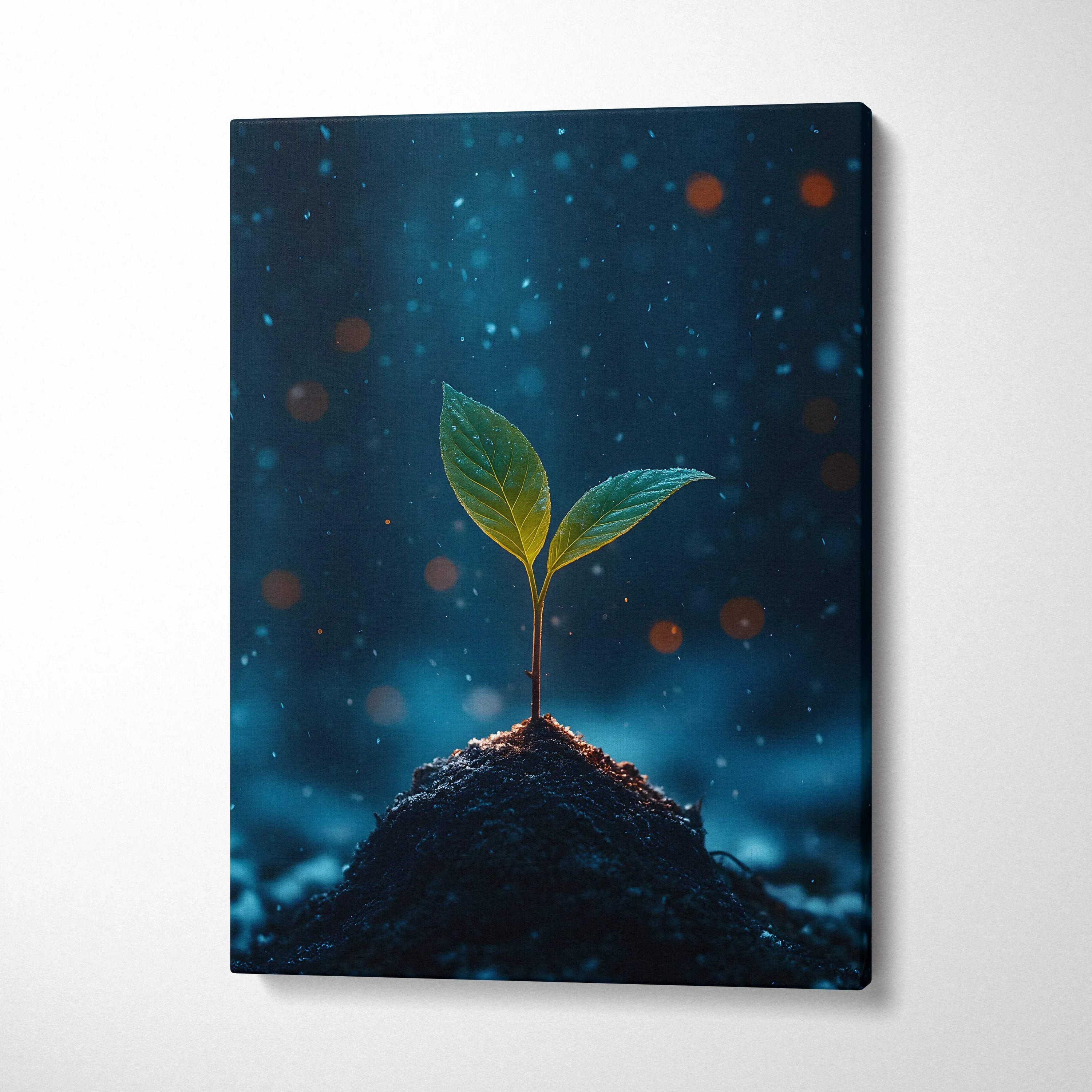 Canvas wall art showing a small green plant sprouting from dark soil with glowing blue and orange bokeh background.