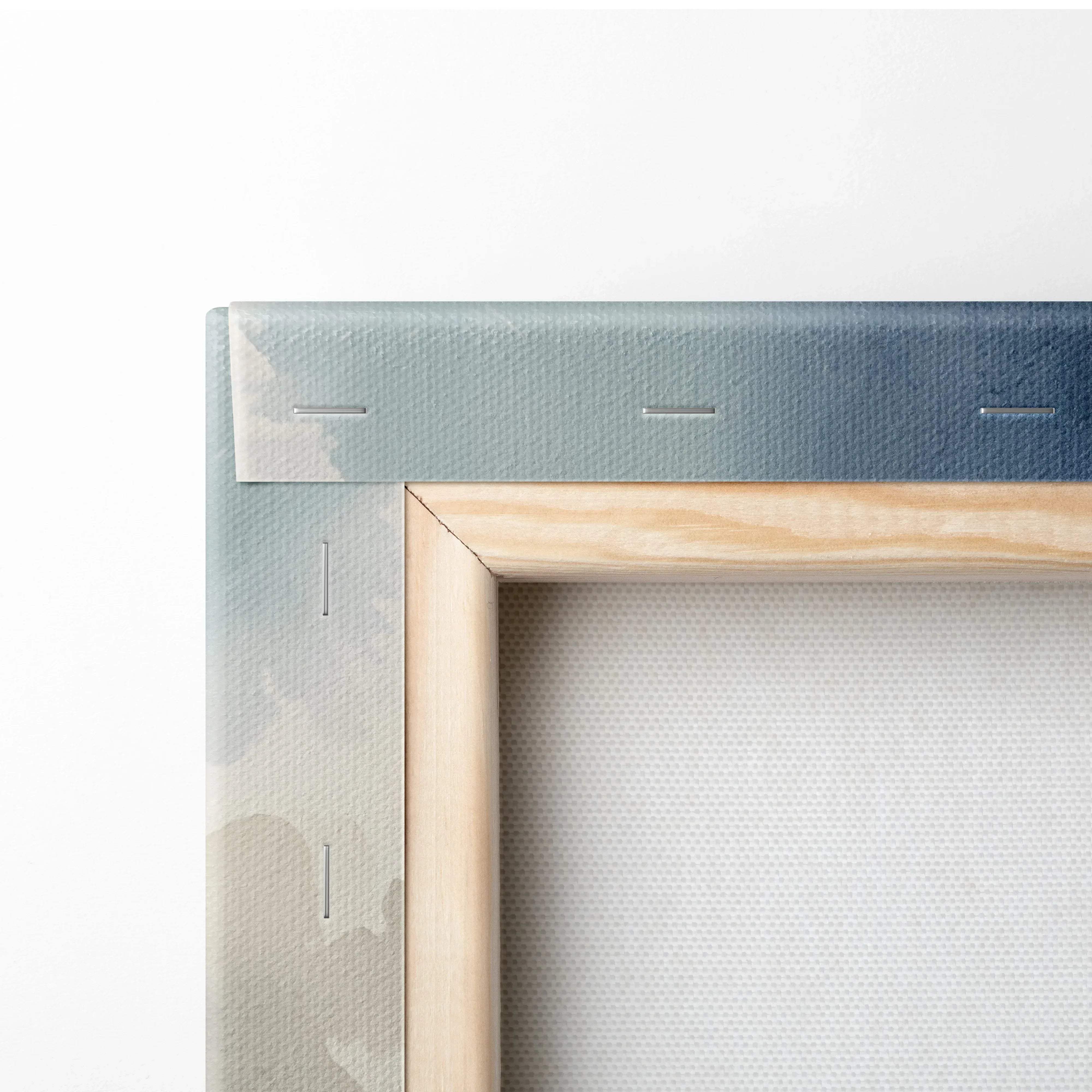 Light wood framed canvas with muted blue and gray gradient border depicting snowy mountain landscape in calm blue tones