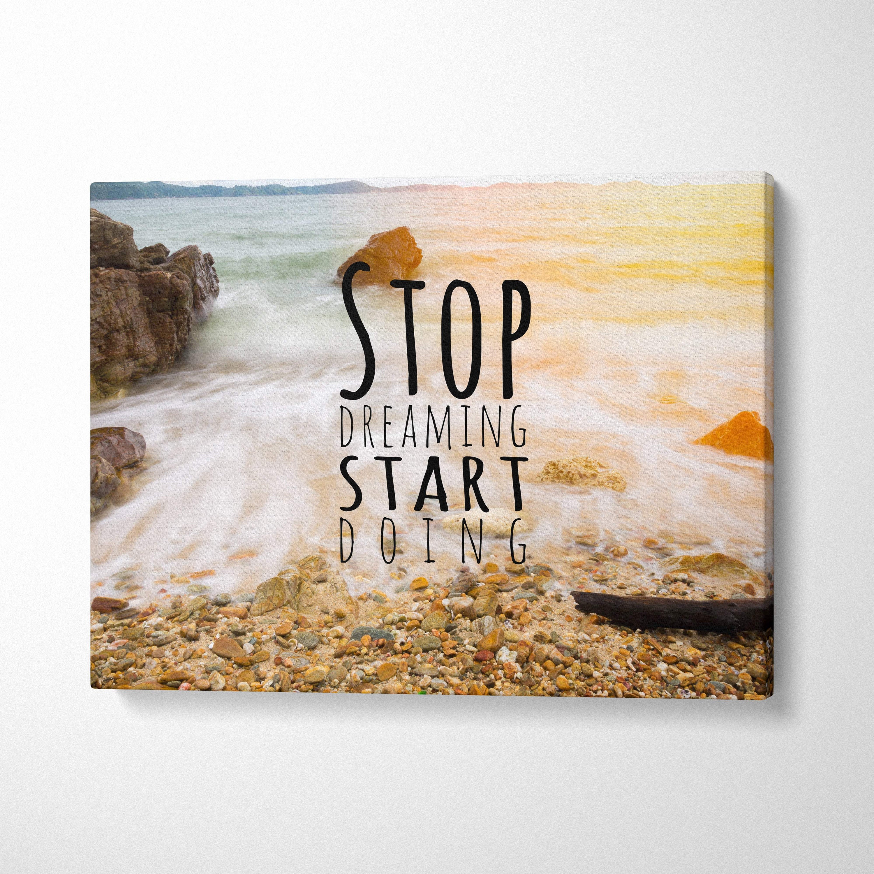 Beige and tan beach scene canvas wall art with black text stop dreaming start doing over ocean waves for coastal decor
