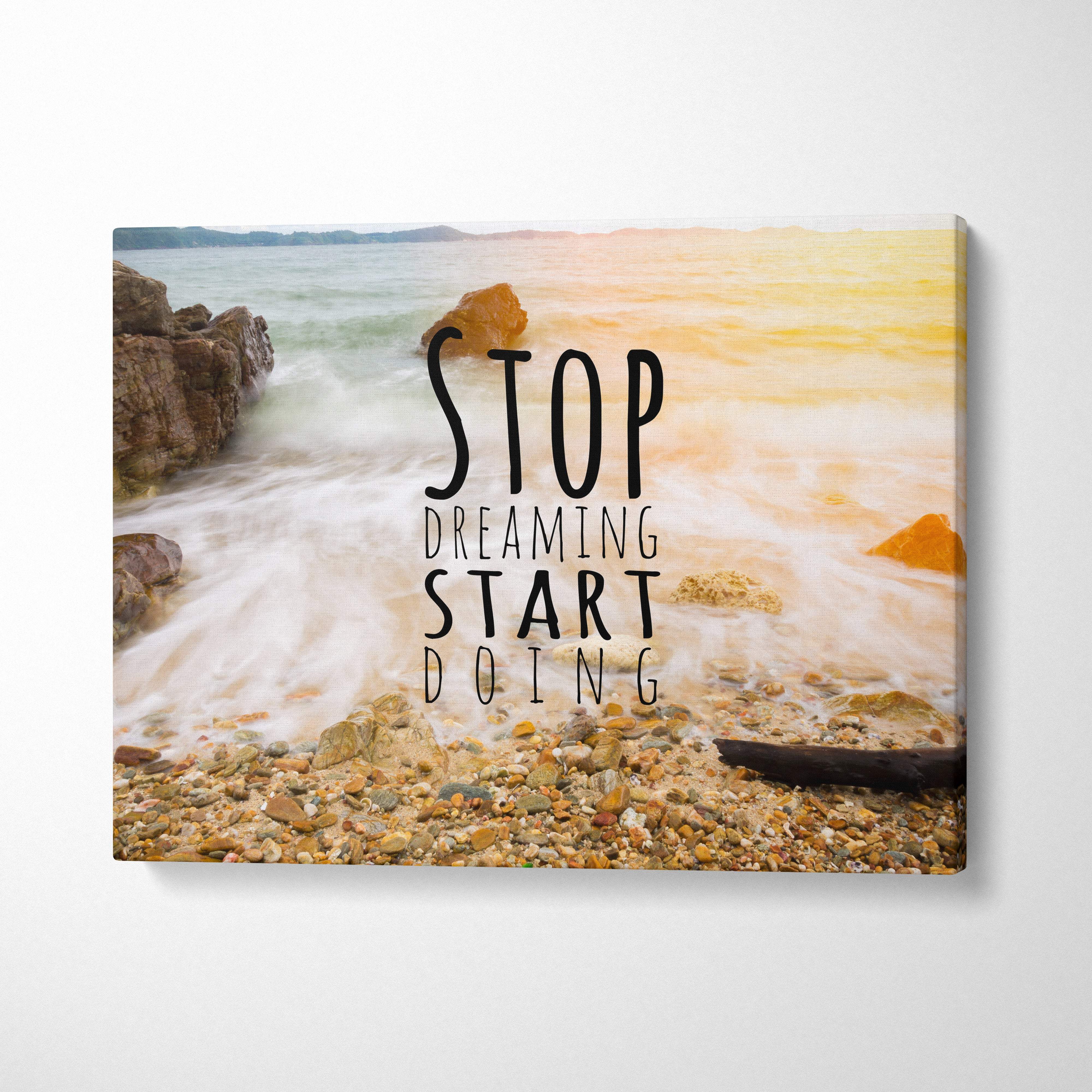 Beige and tan beach scene canvas wall art with black text stop dreaming start doing over ocean waves for coastal decor