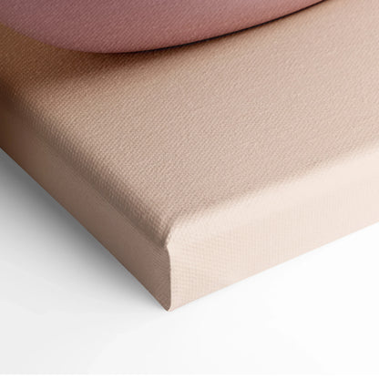 Beige canvas corner stretched on wooden frame for wall art display.