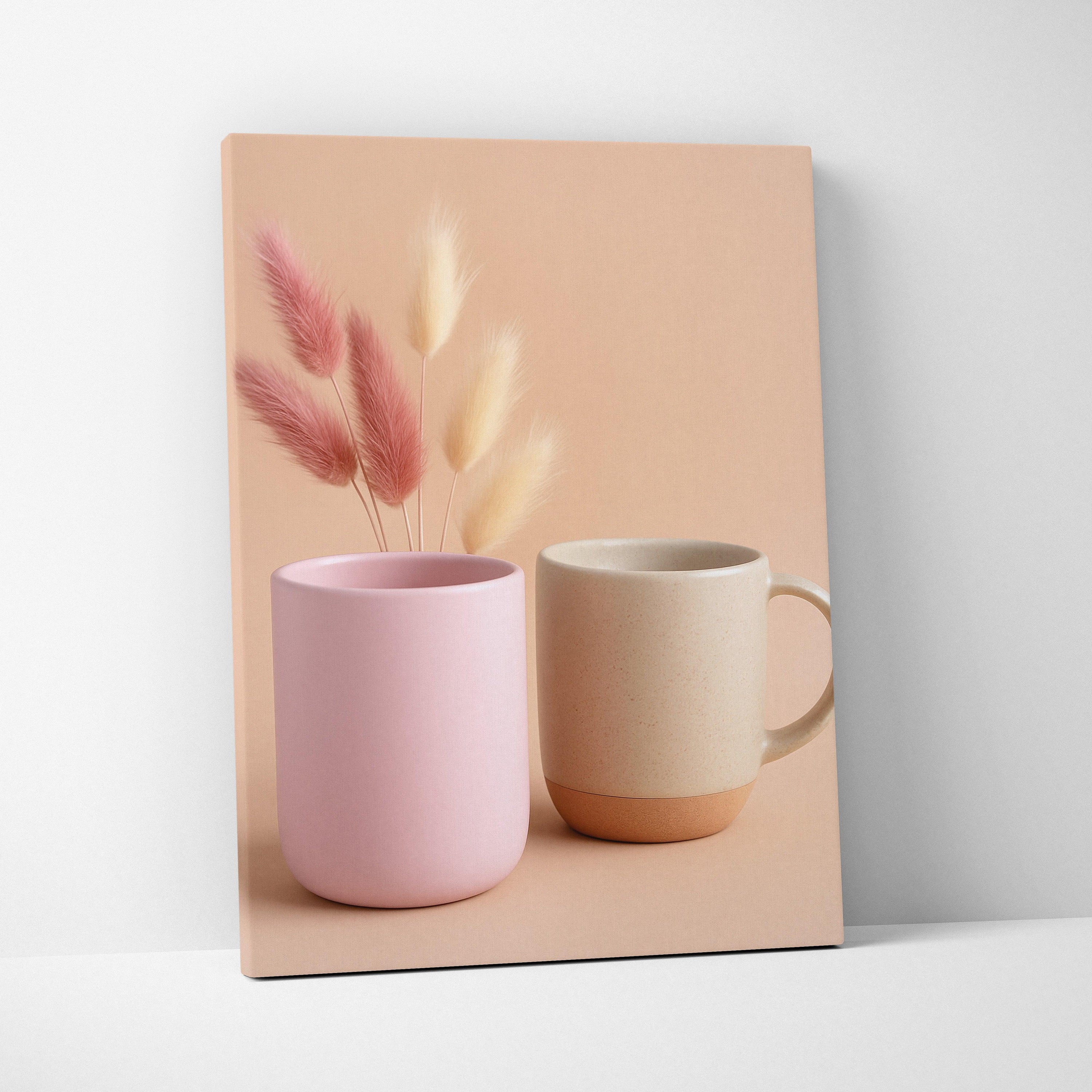 Canvas wall art featuring minimalistic still life with pink and beige ceramic mugs and soft dried floral stems on a neutral.