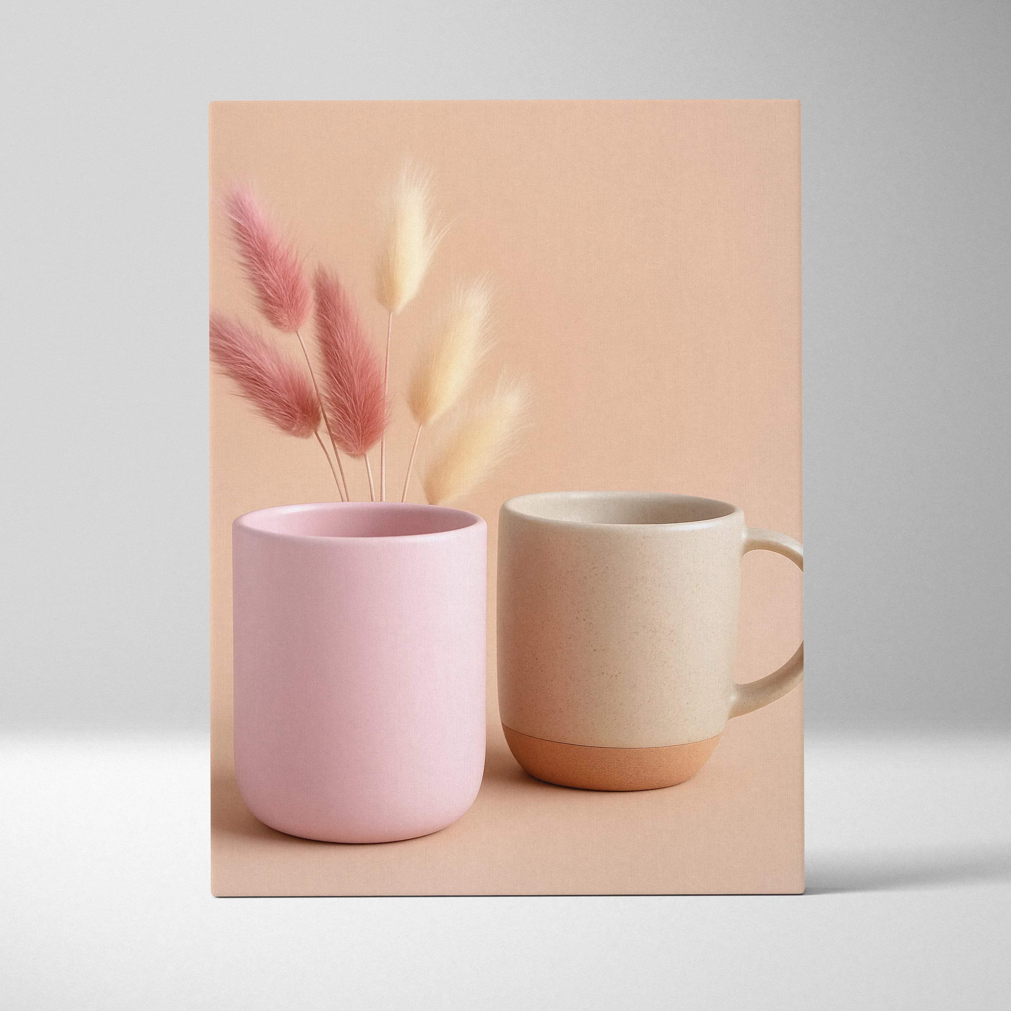 Pastel minimalist still life canvas wall art with two ceramic mugs in soft pink and beige with terracotta base