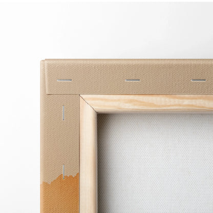 Close-up of stretched canvas corner with wooden frame and stapled backing for wall art.