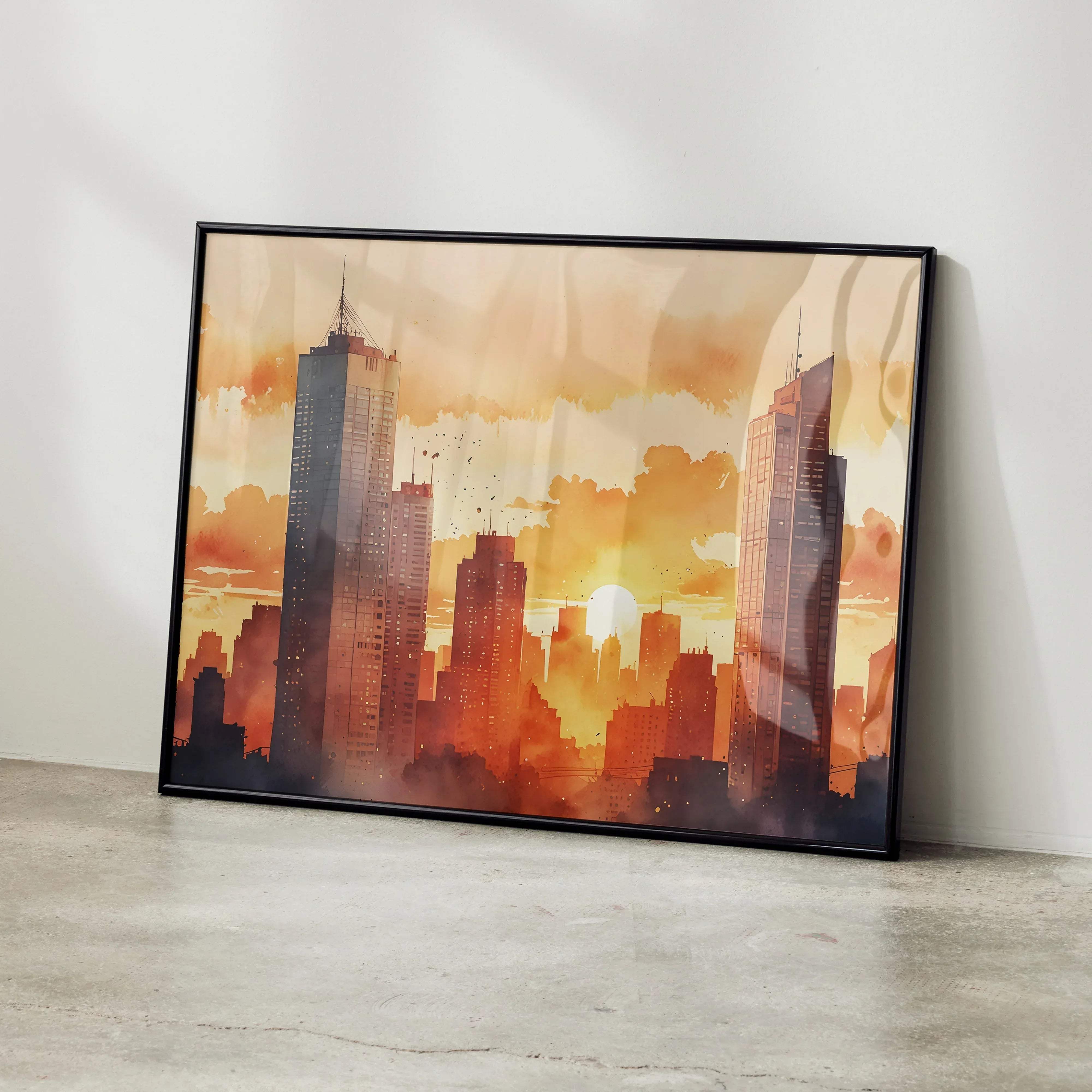 Black-framed watercolor styled sunset cityscape digital art poster with warm orange and golden hues and silhouetted skyscrapers