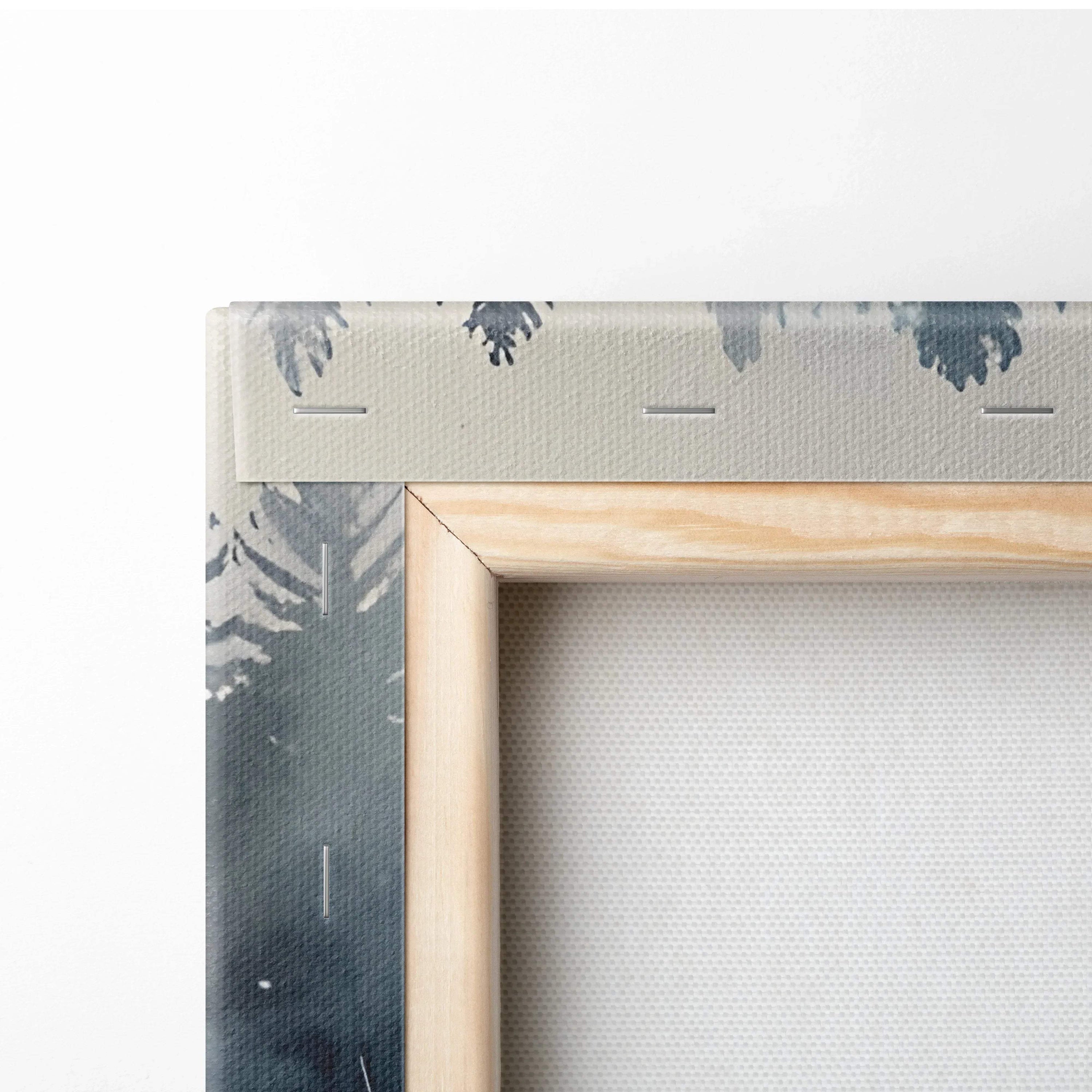 Close-up of wooden frame and canvas texture featuring muted snowy landscape wall art detail.