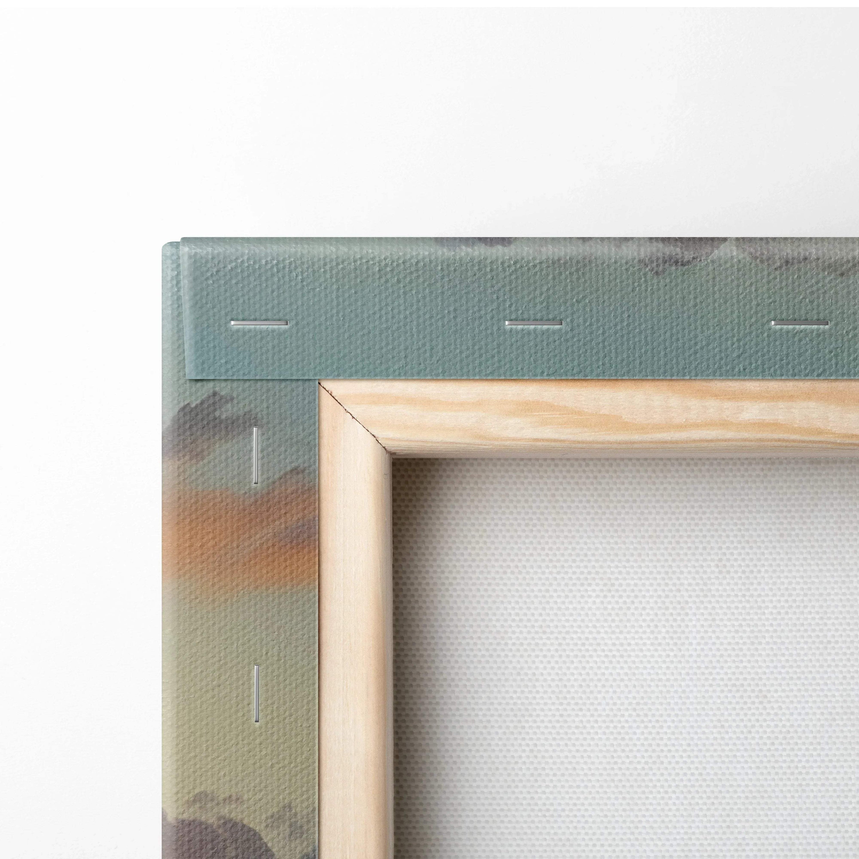 Close-up of canvas edge with sunset landscape art and natural wood frame on wall art.
