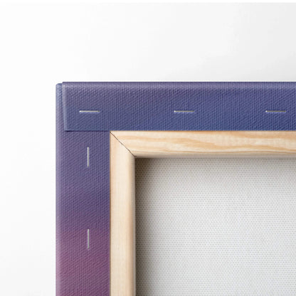 Close-up of stretched canvas corner with wooden frame and purple gradient fabric backing for wall art.