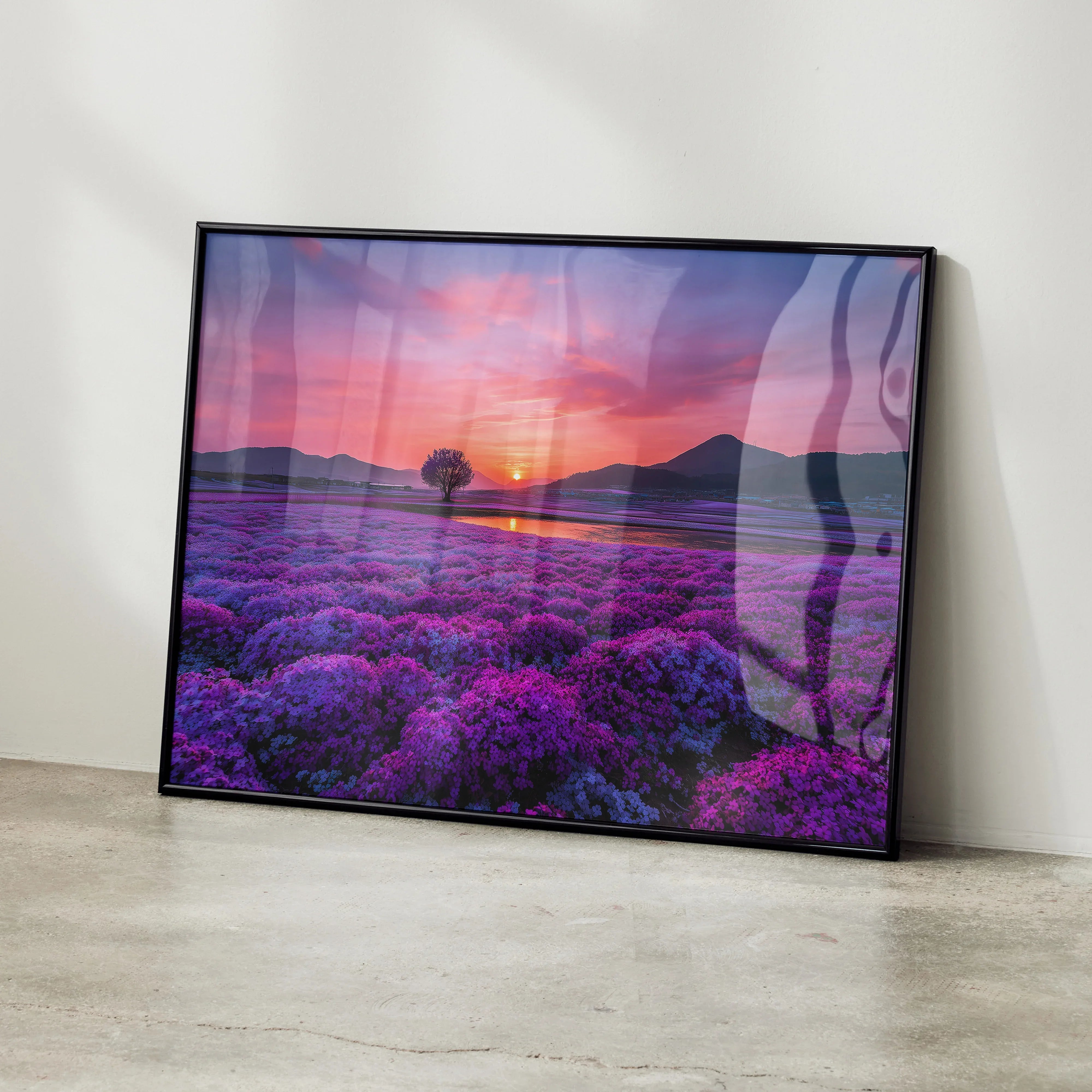 Floral sunset nature wall art poster with vibrant purple flowers and glowing orange sky in black frame.