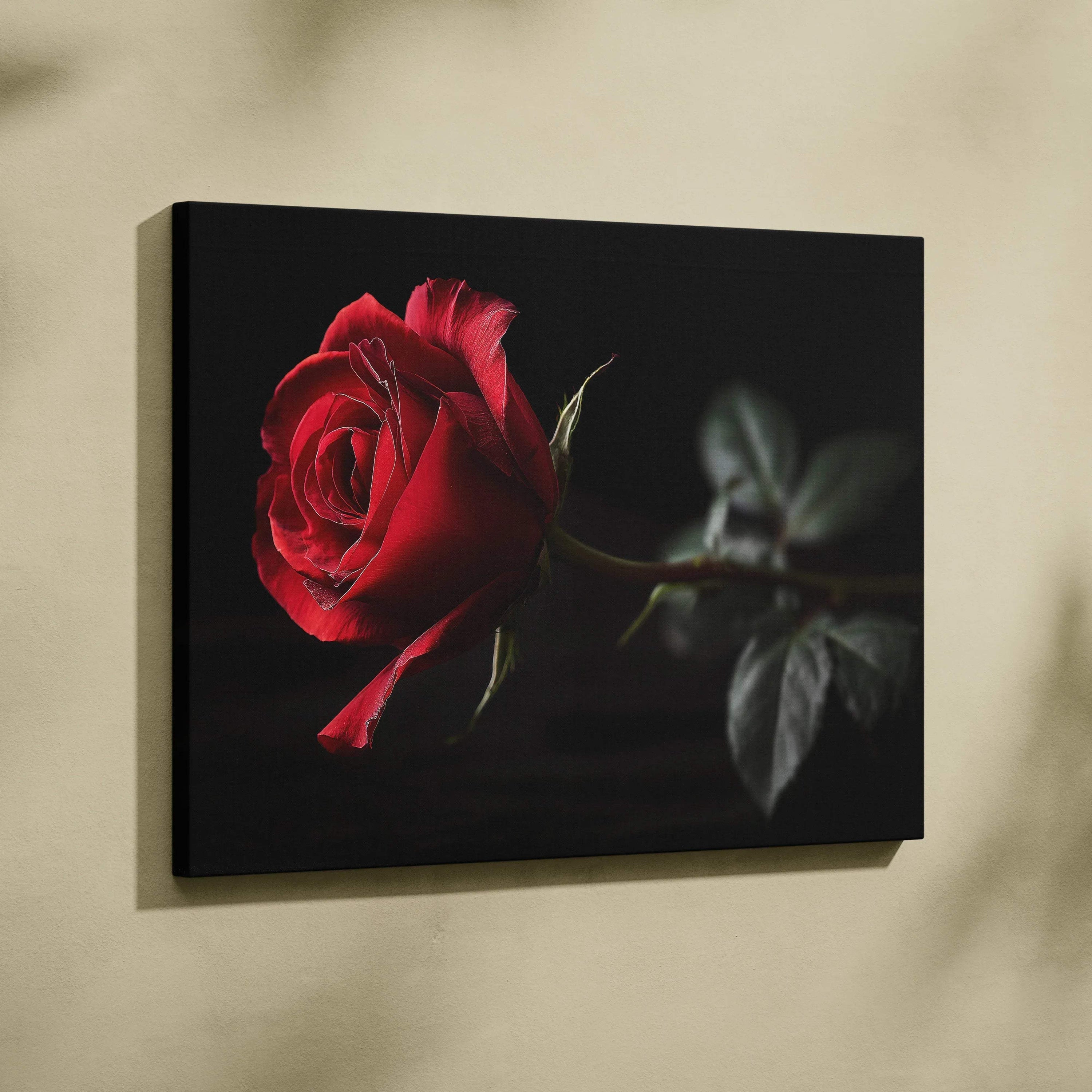 Canvas wall art featuring a vibrant red rose against a dark background with detailed petals and leaves.