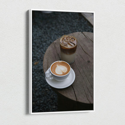 Coffee latte and iced coffee on round wooden table canvas wall art print in vertical orientation.