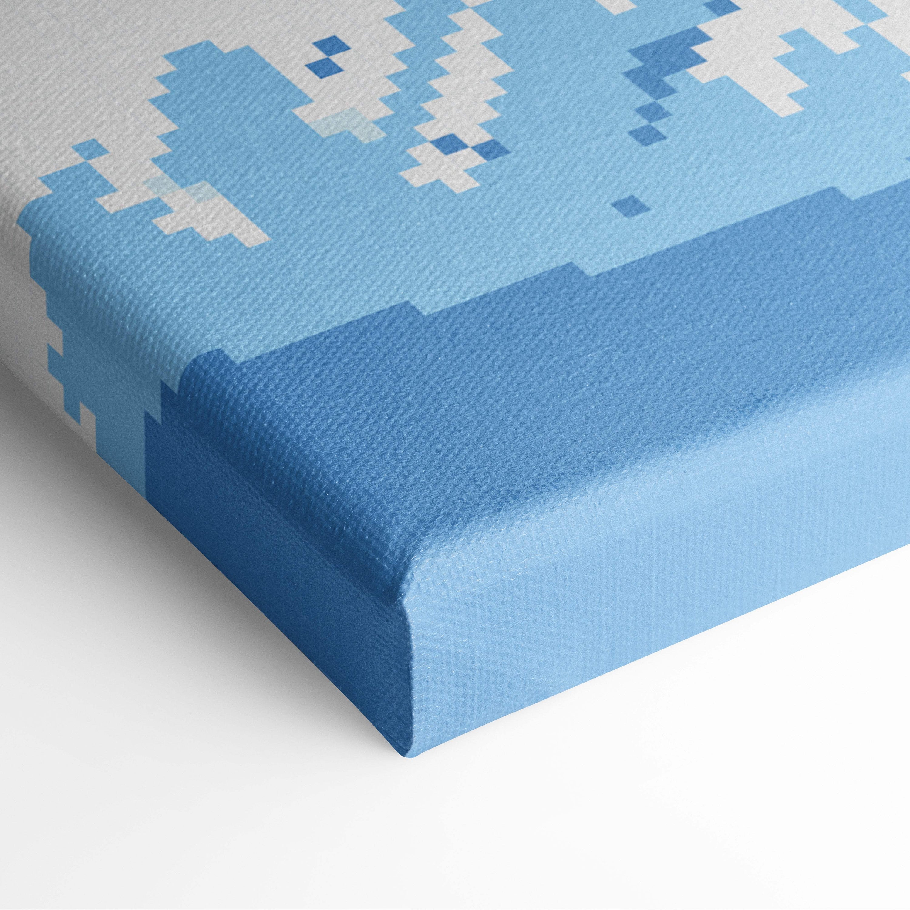Blue pixelated canvas print with textured gallery-wrapped edge showcasing snowy mountain pixel art wall decor
