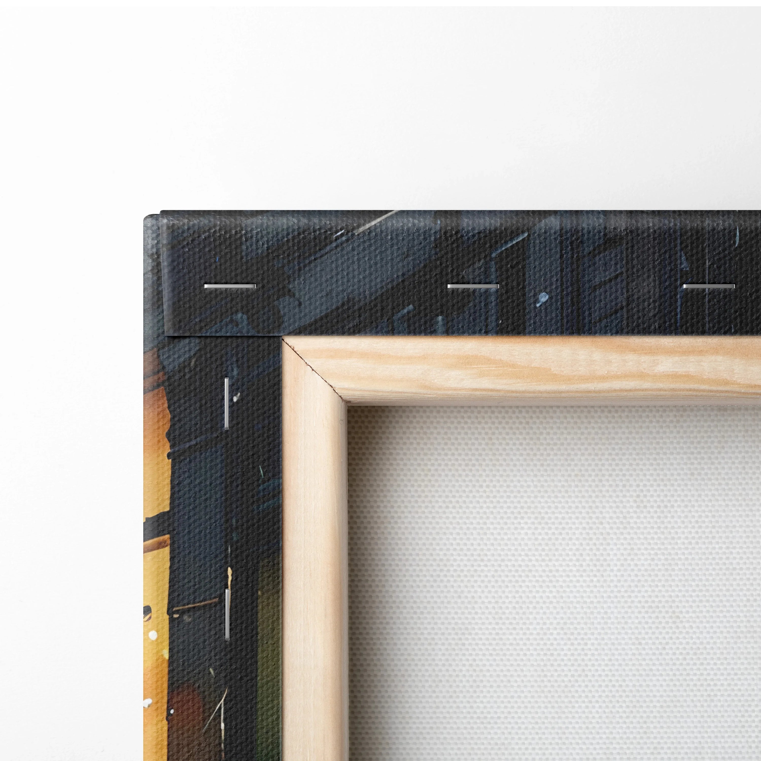 Close-up of corner of black cityscape watercolor canvas wall art with natural wood frame.