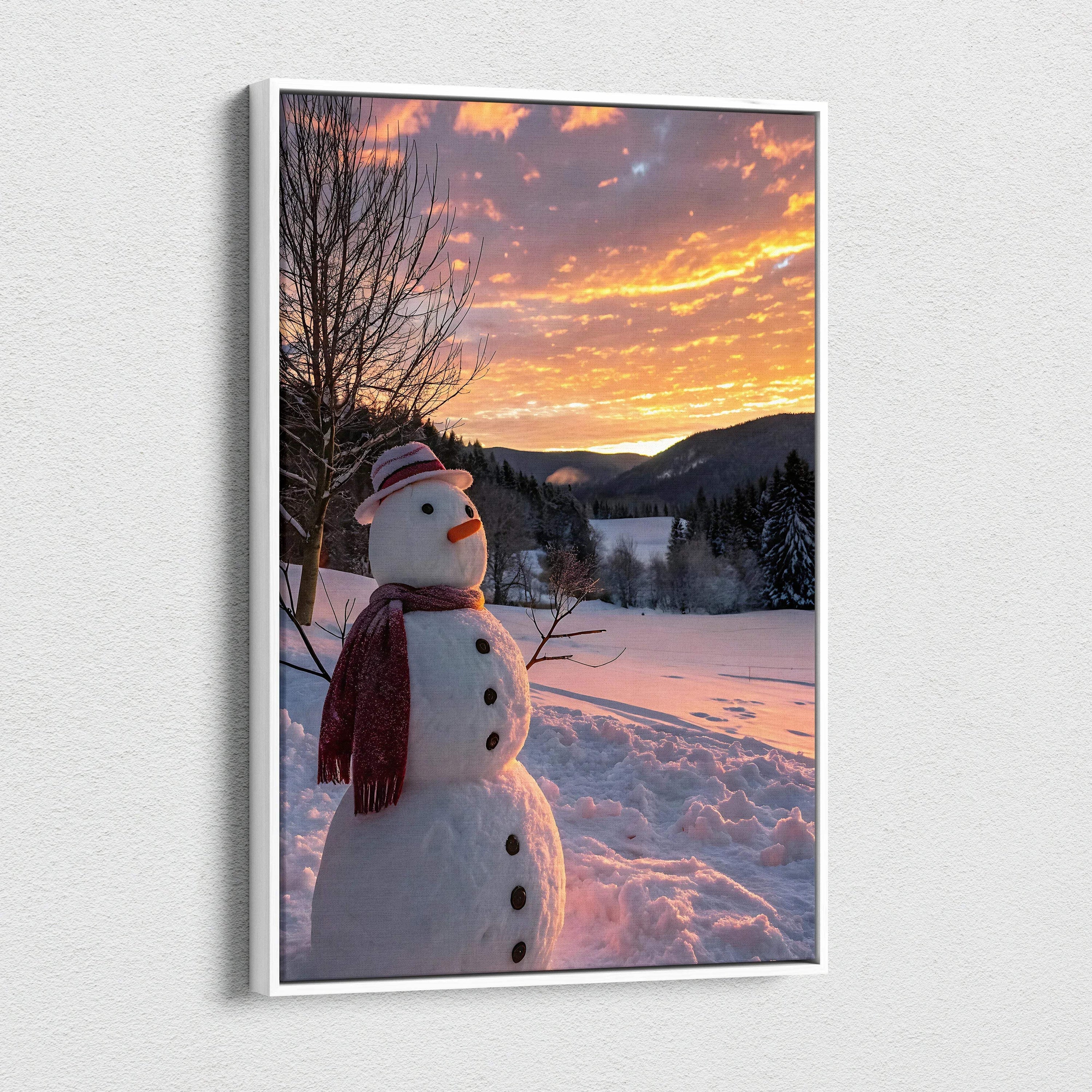 Canvas wall art featuring a snowman in a snowy landscape at sunset with vibrant orange sky.