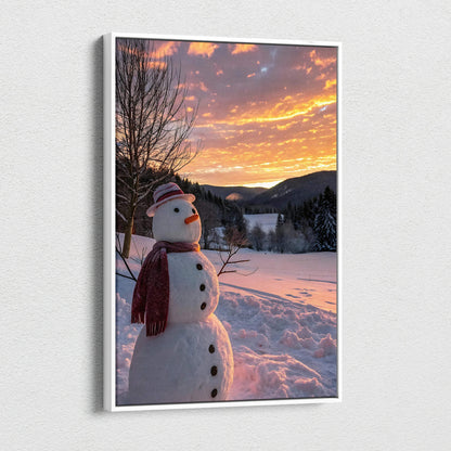 Canvas wall art featuring a snowman in a snowy landscape at sunset with vibrant orange sky.