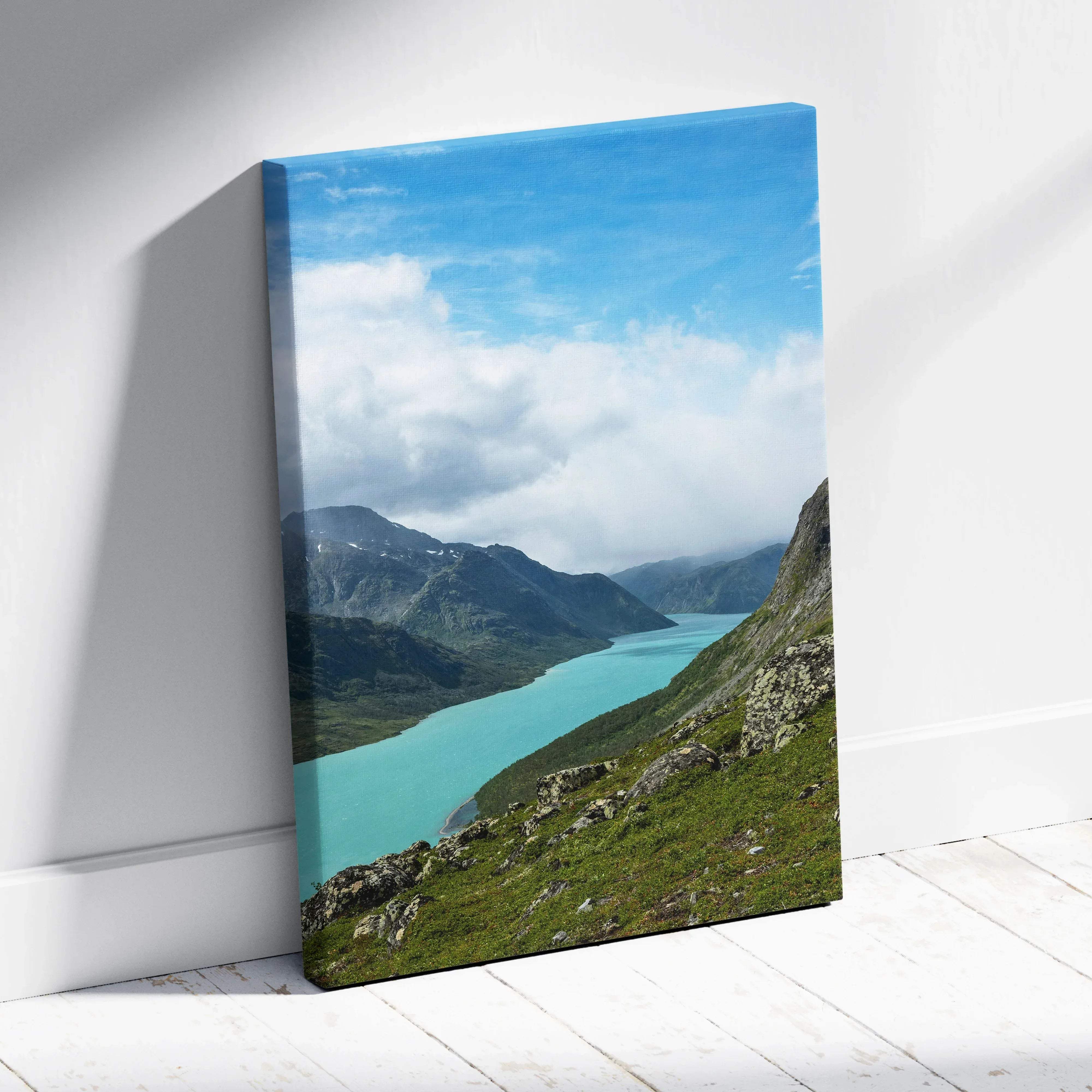 Majestic mountain landscape canvas wall art featuring a turquoise lake and lush valleys under bright blue sky