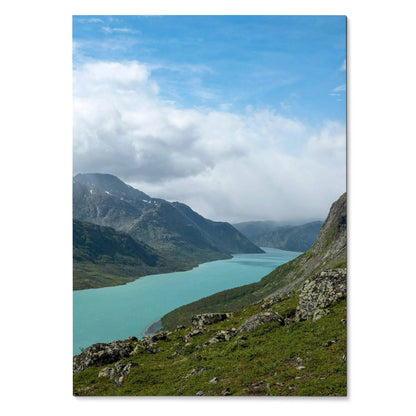 Vertical mountain landscape poster featuring a turquoise lake and cloudy sky wall art.