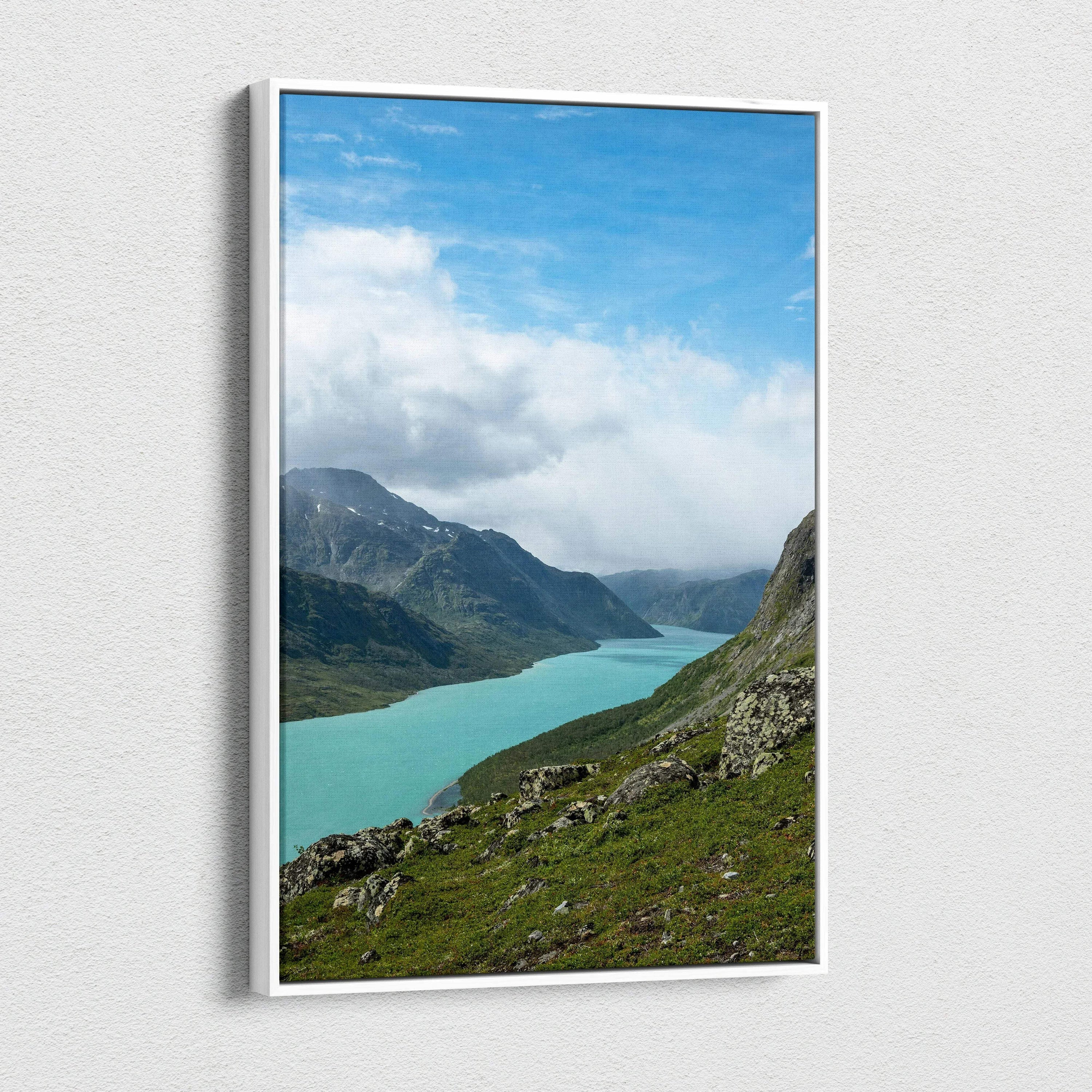 Vertical canvas wall art featuring a serene mountain landscape with turquoise lake under blue sky.