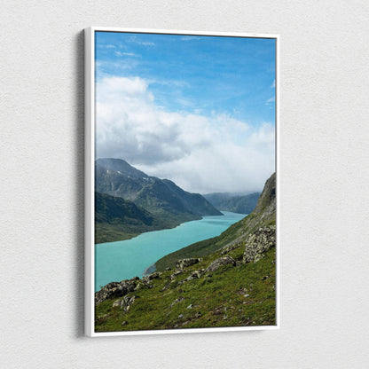 Vertical canvas wall art featuring a serene mountain landscape with turquoise lake under blue sky.