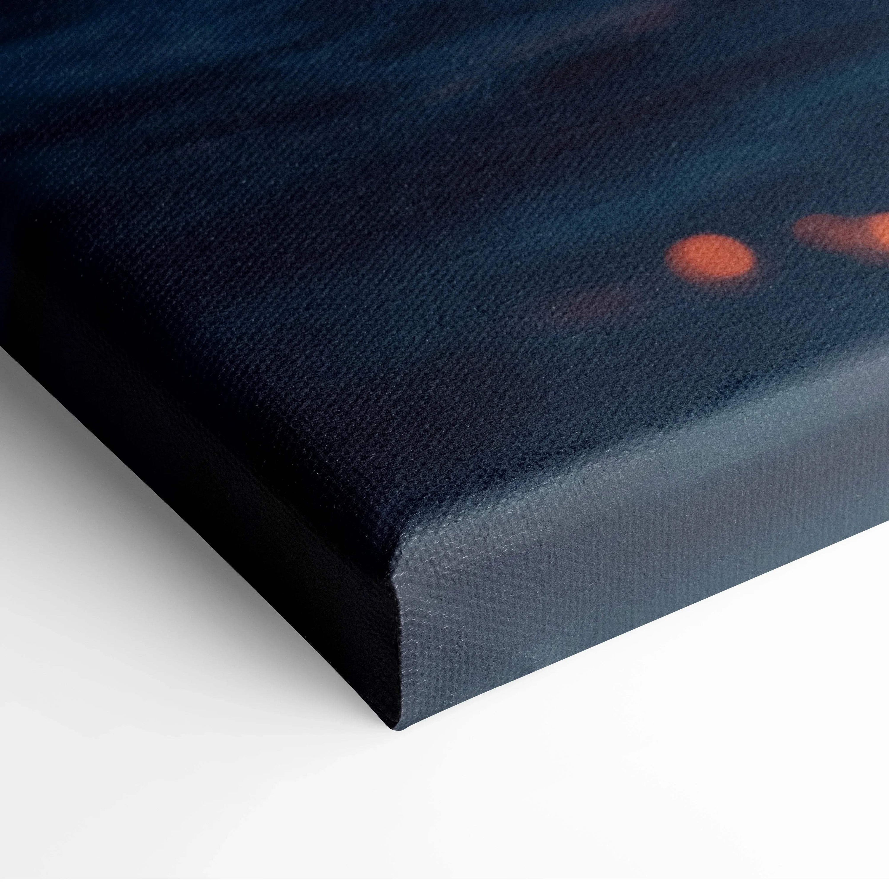 Dark blue canvas wall art with subtle orange sunset hues and textured surface.