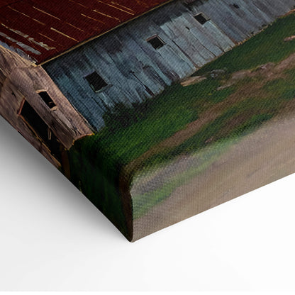 Lightning storm over farm canvas wall art featuring a rustic barn with weathered red roof and blue gray siding on textured canvas