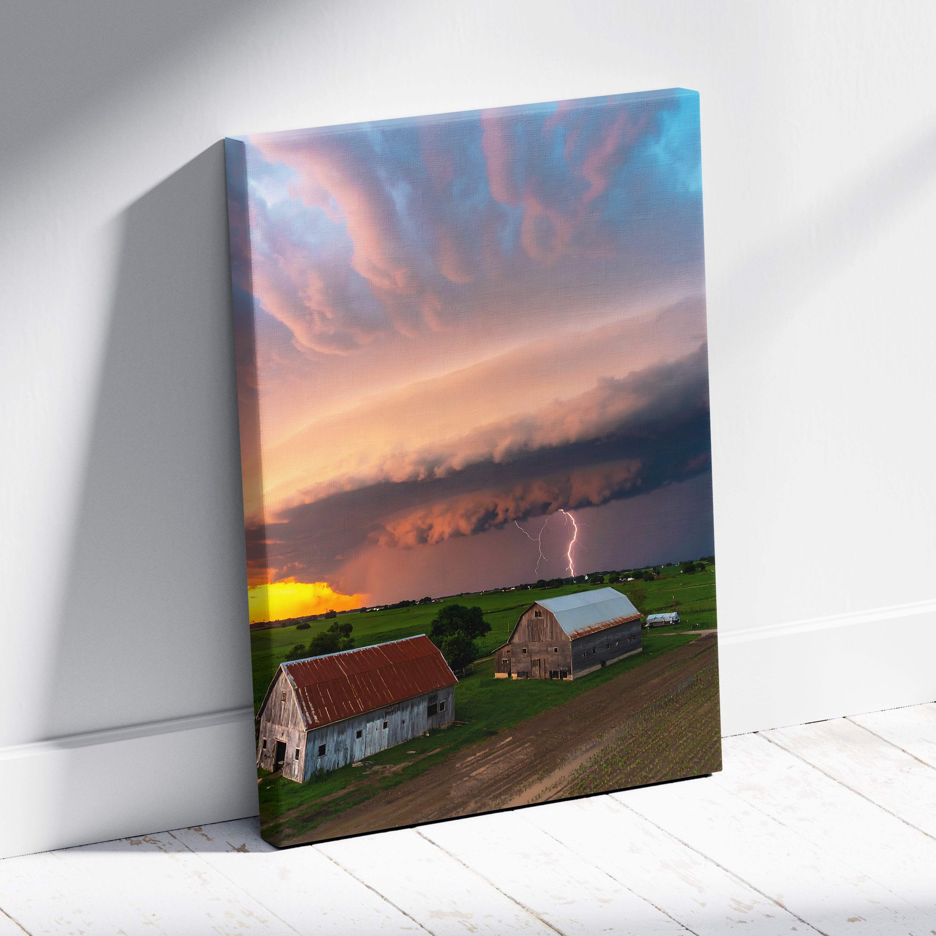 Canvas print of lightning storm over rustic barns with dramatic sunset sky for farmhouse wall decor