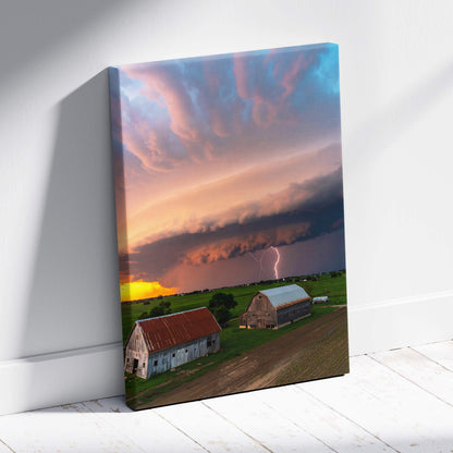 Canvas print of lightning storm over rustic barns with dramatic sunset sky for farmhouse wall decor