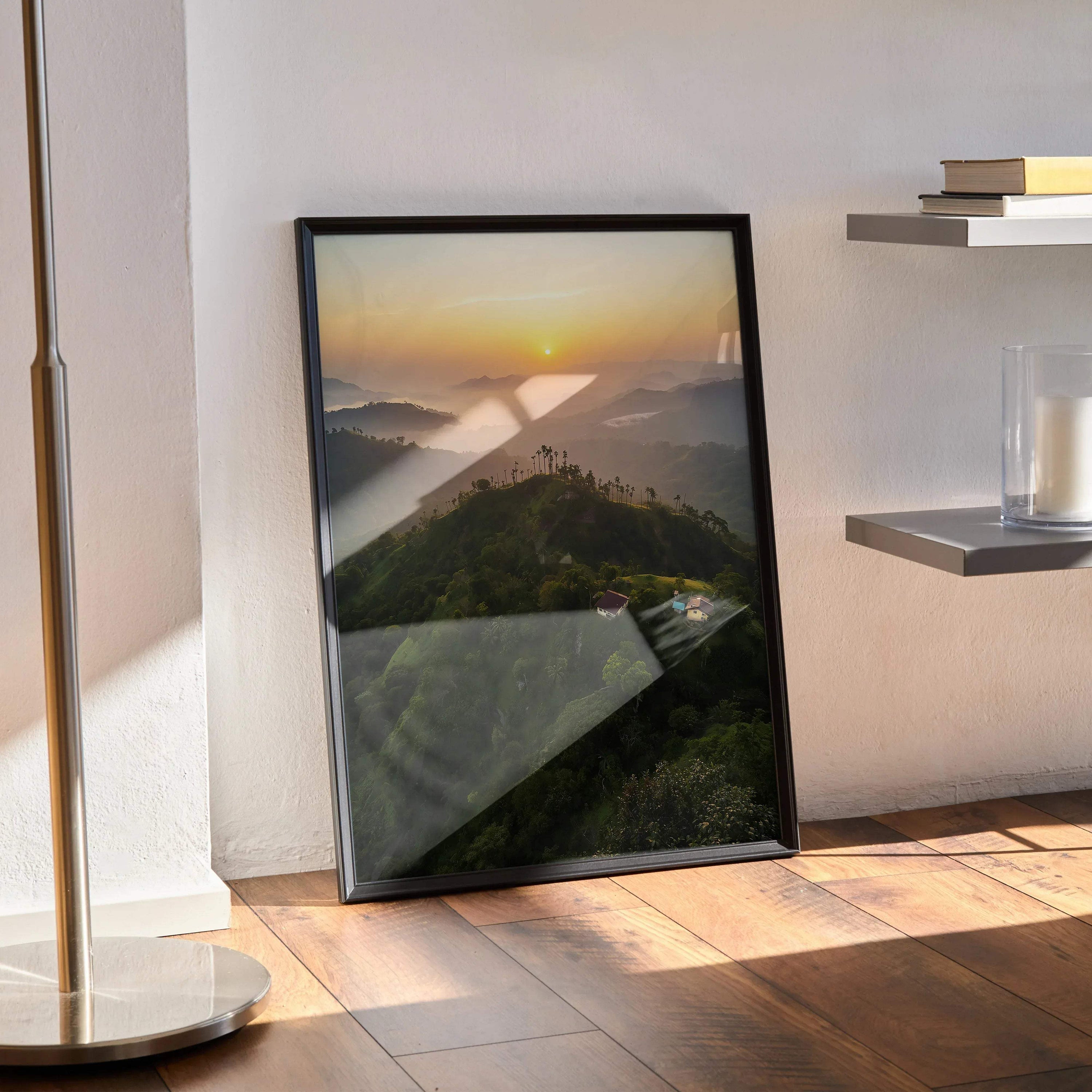 Vertical sunset nature poster with glowing sun over river and green hills, framed wall art.