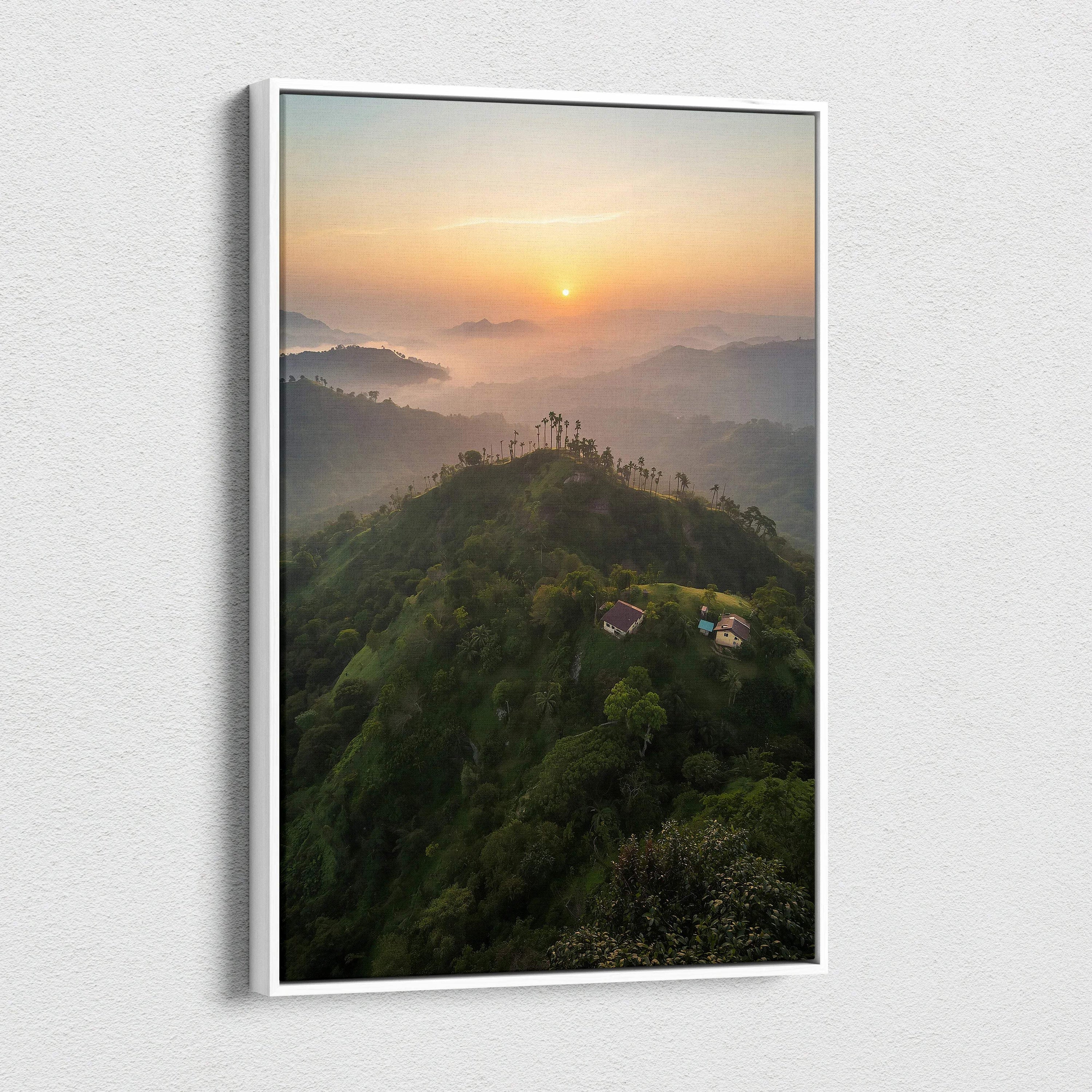 Vertical canvas wall art featuring a misty mountain landscape at sunset with soft orange and purple hues.