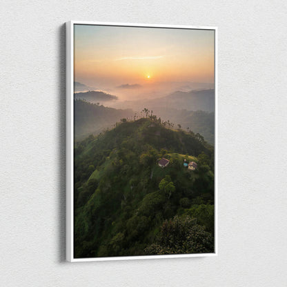 Vertical canvas wall art featuring a misty mountain landscape at sunset with soft orange and purple hues.