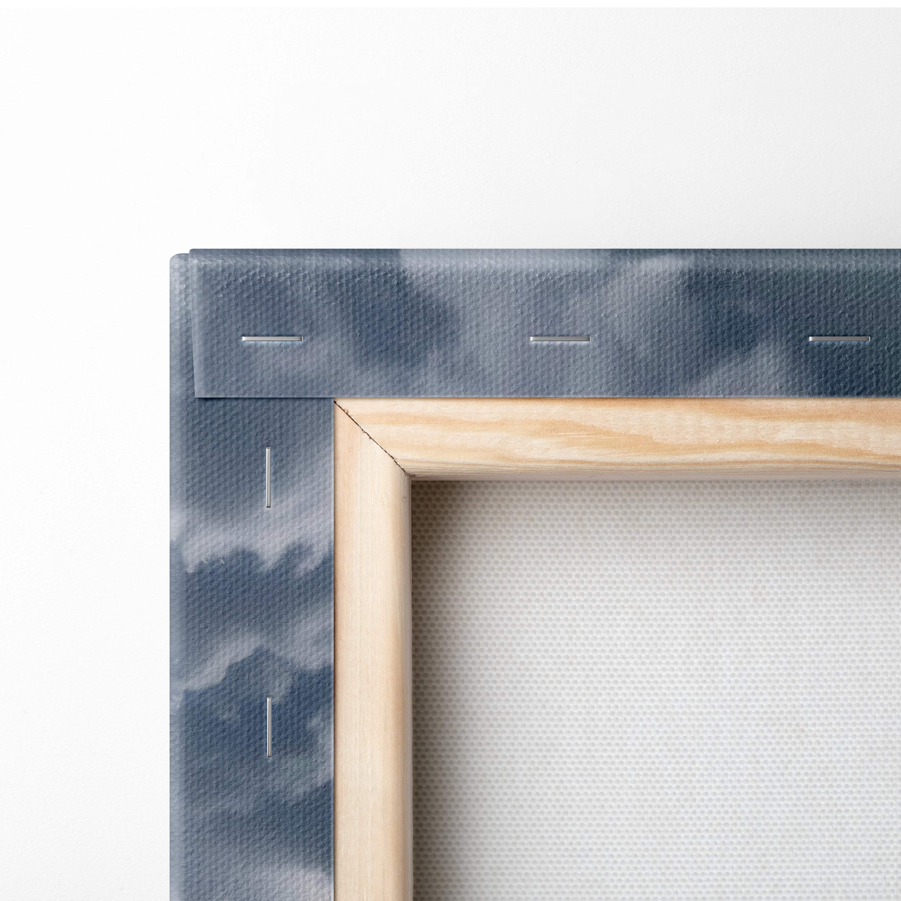 Light wood-framed canvas wall art with dark blue tie-dye edge featuring massive tornado over farmhouse storm scene