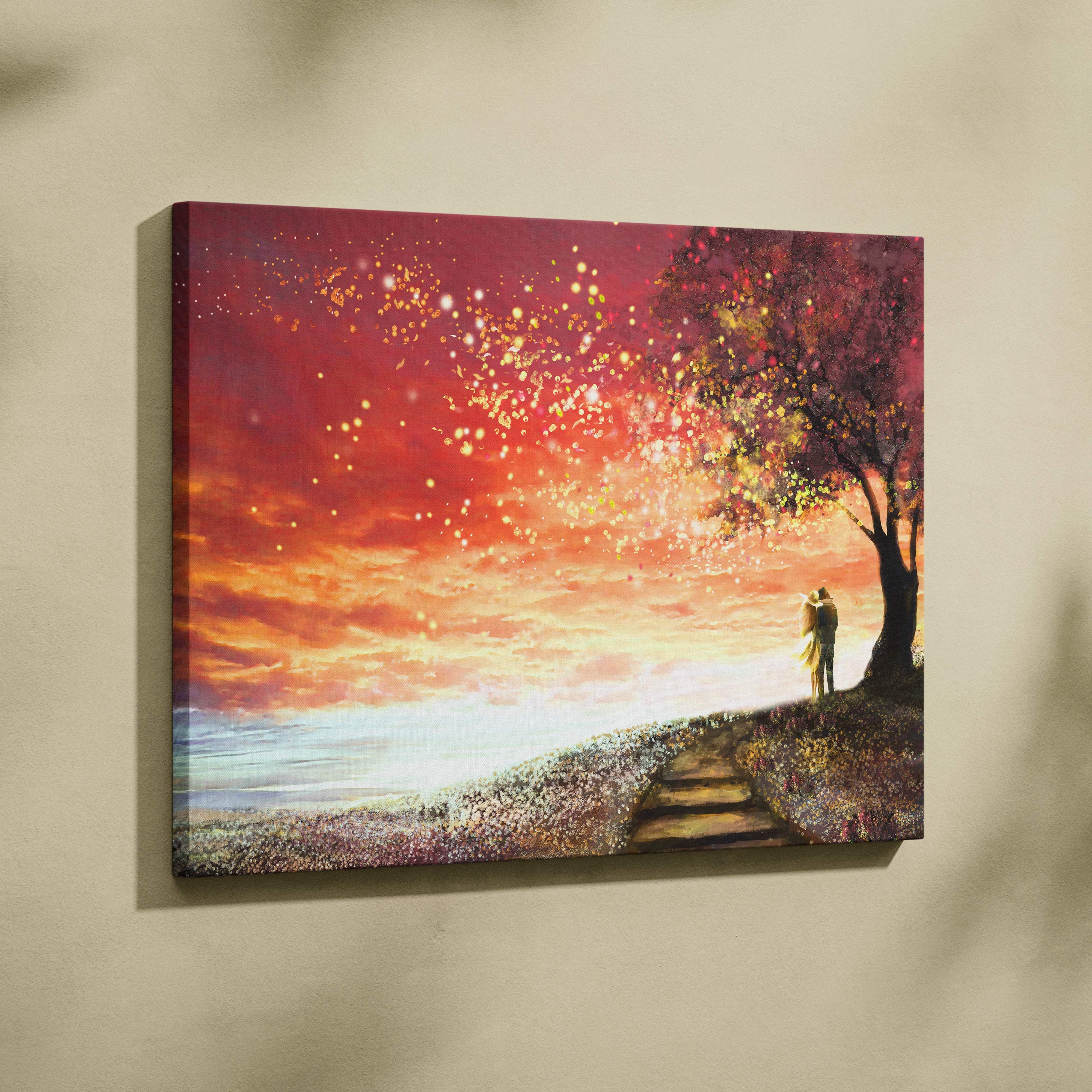 Romantic sunset couple canvas print with glowing sky, blossoming tree, fireflies, and vibrant orange pink hues