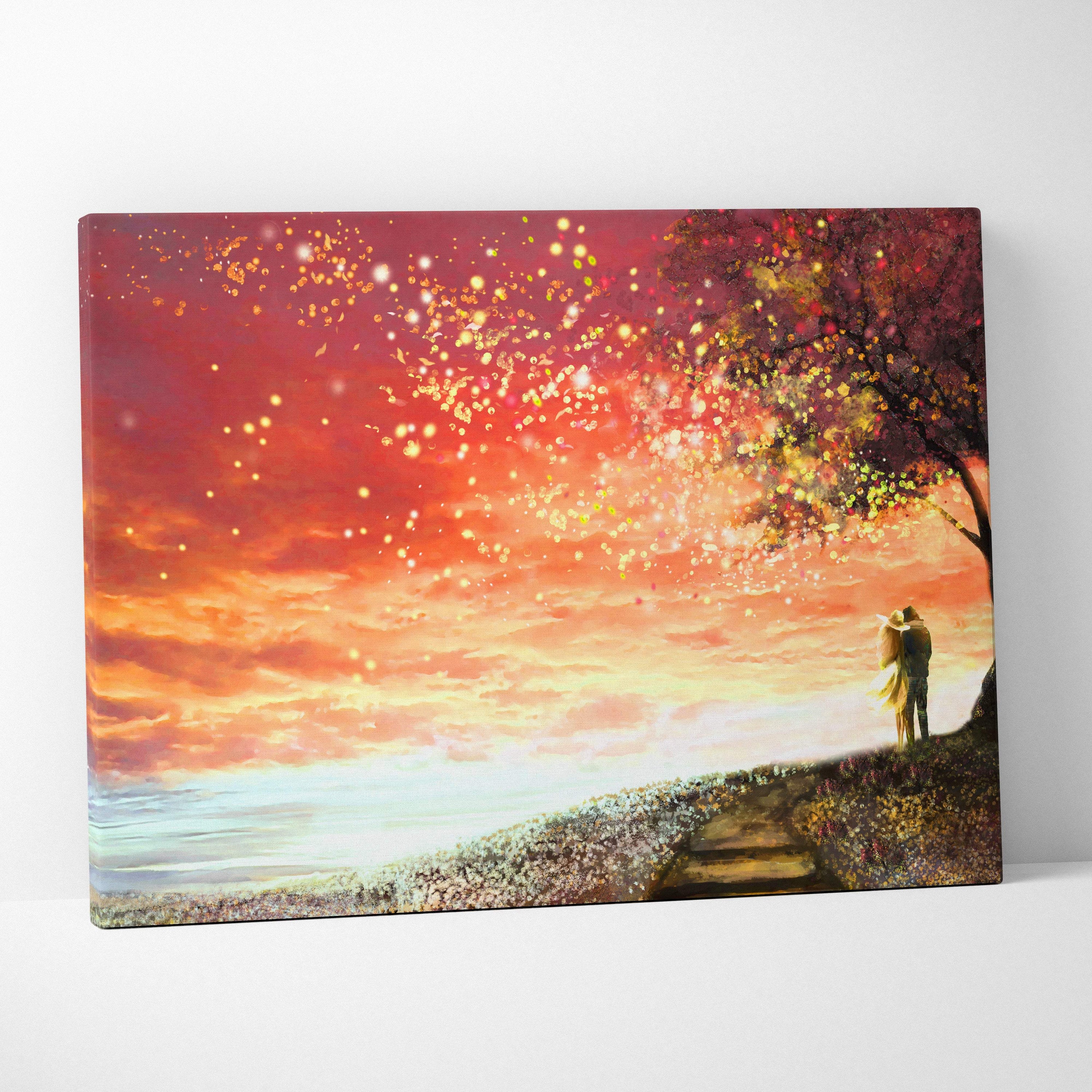 A rectangular canvas print of a romantic couple under a blossoming tree with glowing particles at sunset