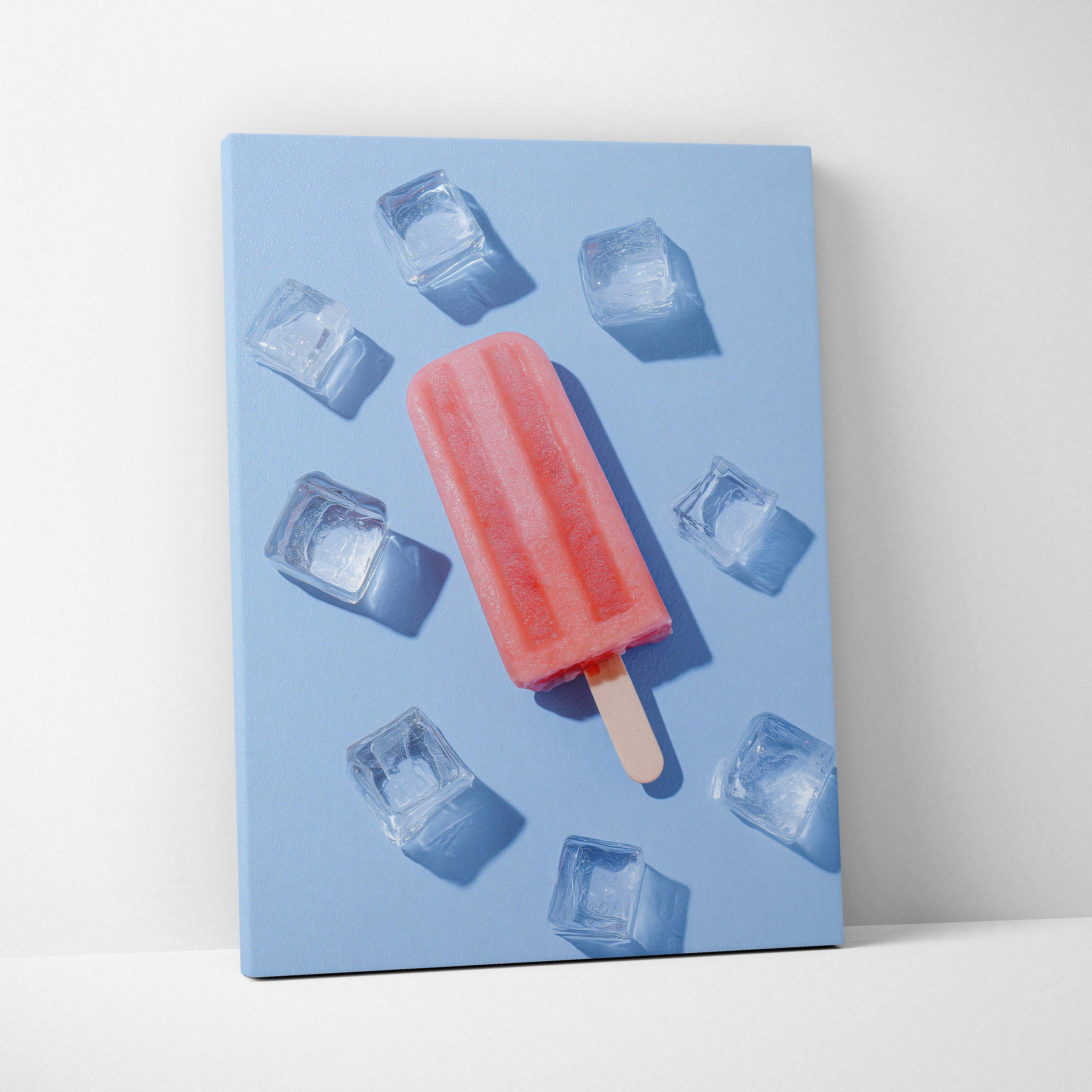 Canvas wall art featuring a vibrant red popsicle surrounded by ice cubes on a blue background.