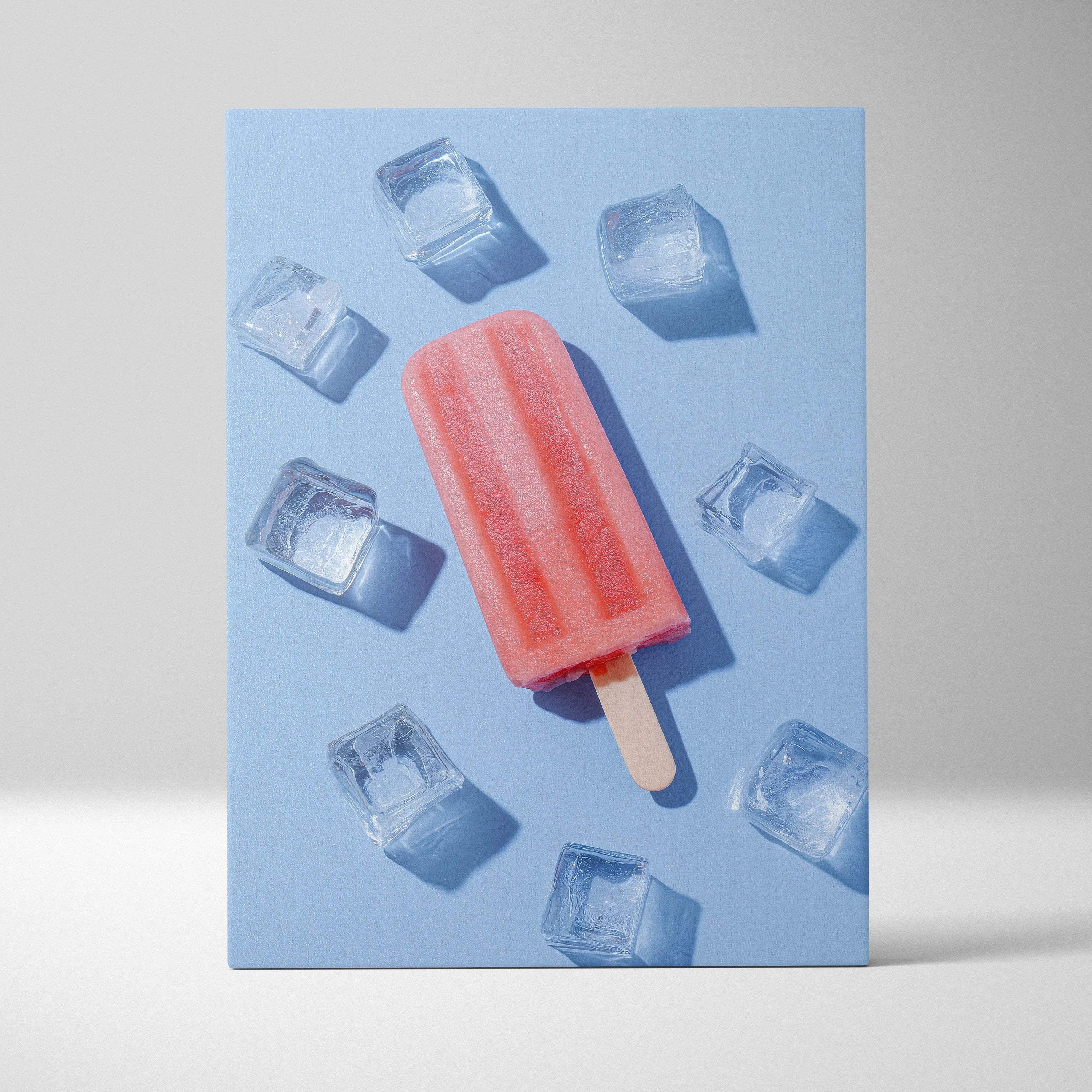 Vertical canvas wall art featuring vibrant digital illustration of a red popsicle with ice cubes on a blue background.