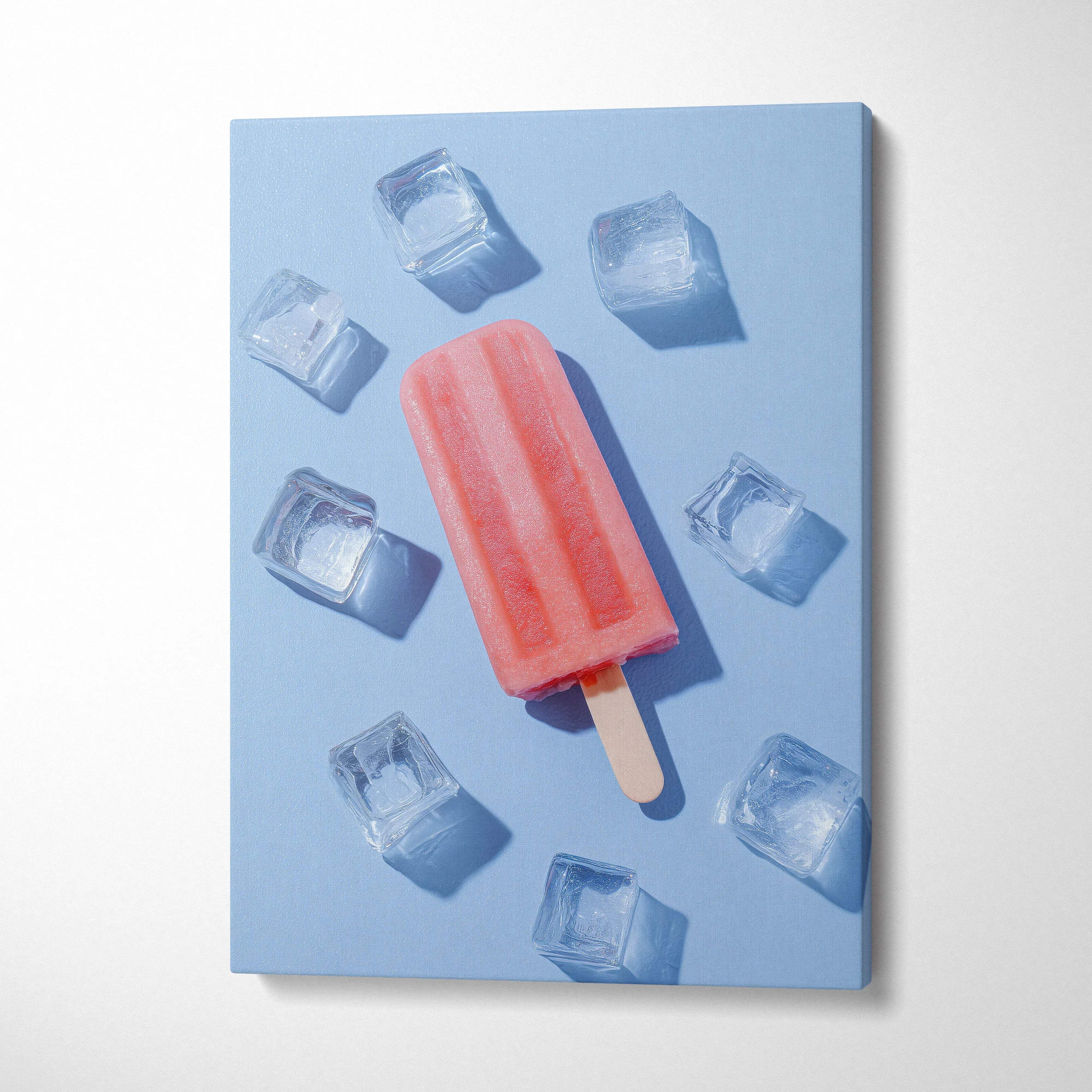 Vertical canvas wall art featuring a vibrant red popsicle surrounded by ice cubes on a light blue background.