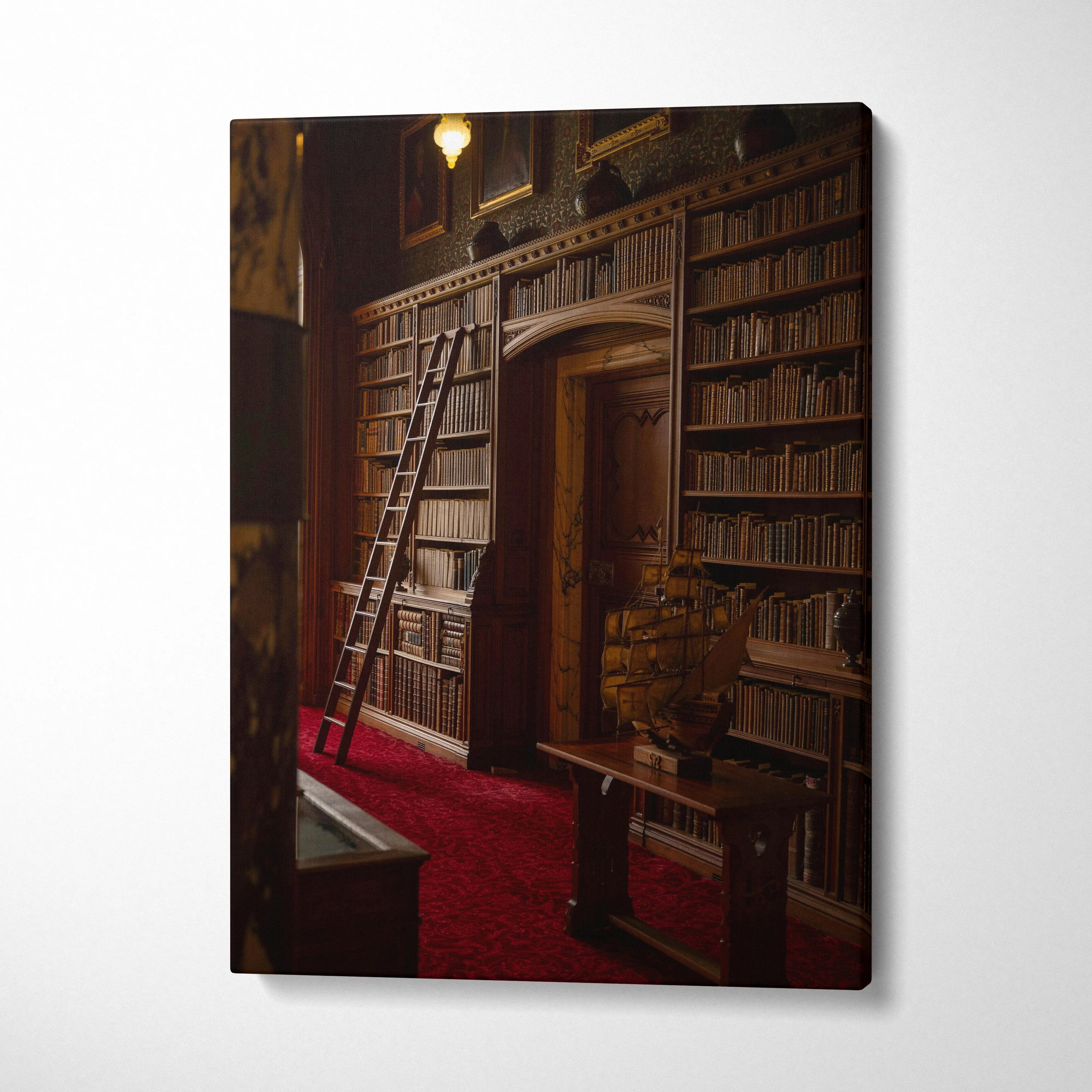 Canvas wall art featuring a vintage library with tall wooden bookshelves and a rolling ladder on red carpet.