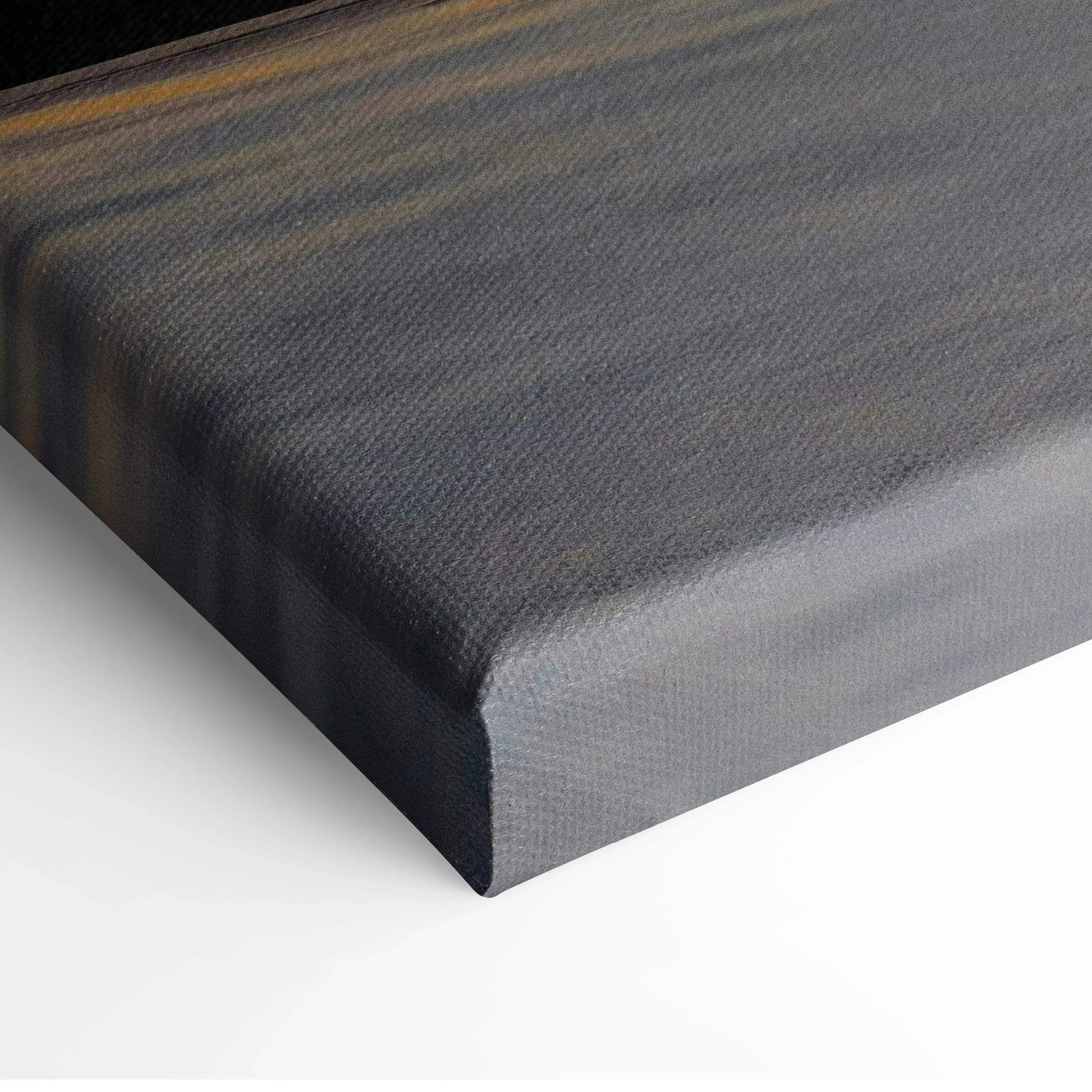 Close-up of dark canvas wall art stretched on frame with subtle texture.