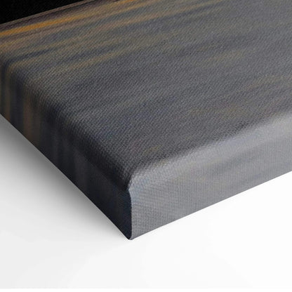 Close-up of dark canvas wall art stretched on frame with subtle texture.