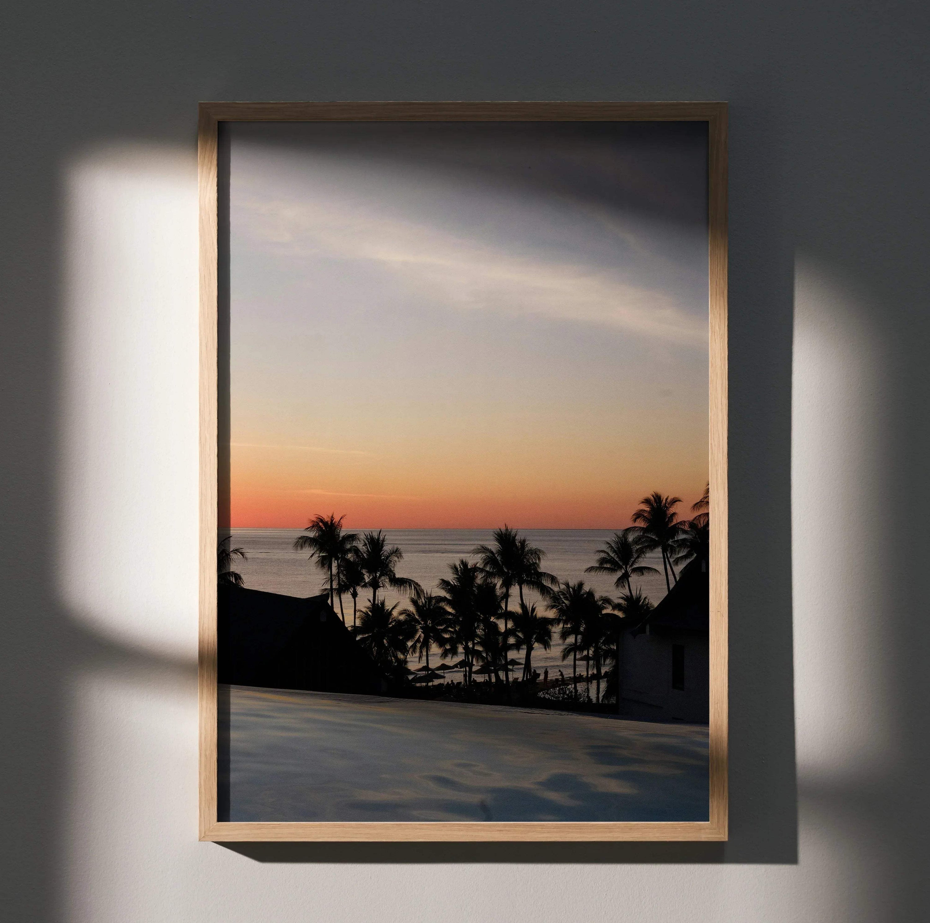Serene beach sunset poster with palm trees silhouette and soft pastel sky wall art.