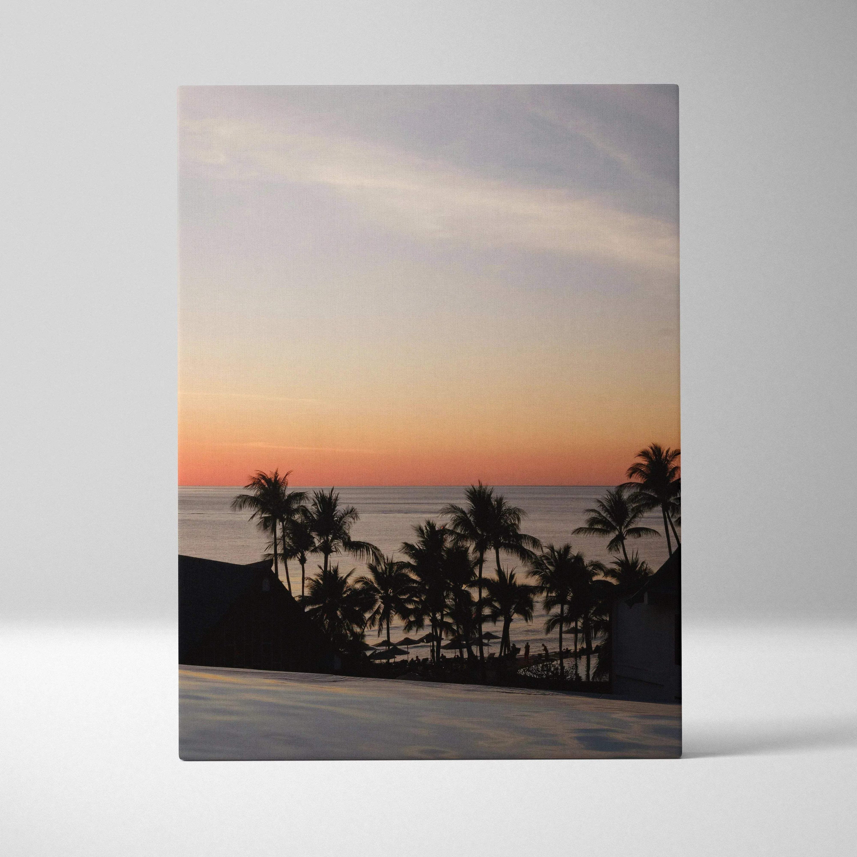 Canvas wall art featuring vivid golden sunset over beach with palm trees silhouette.