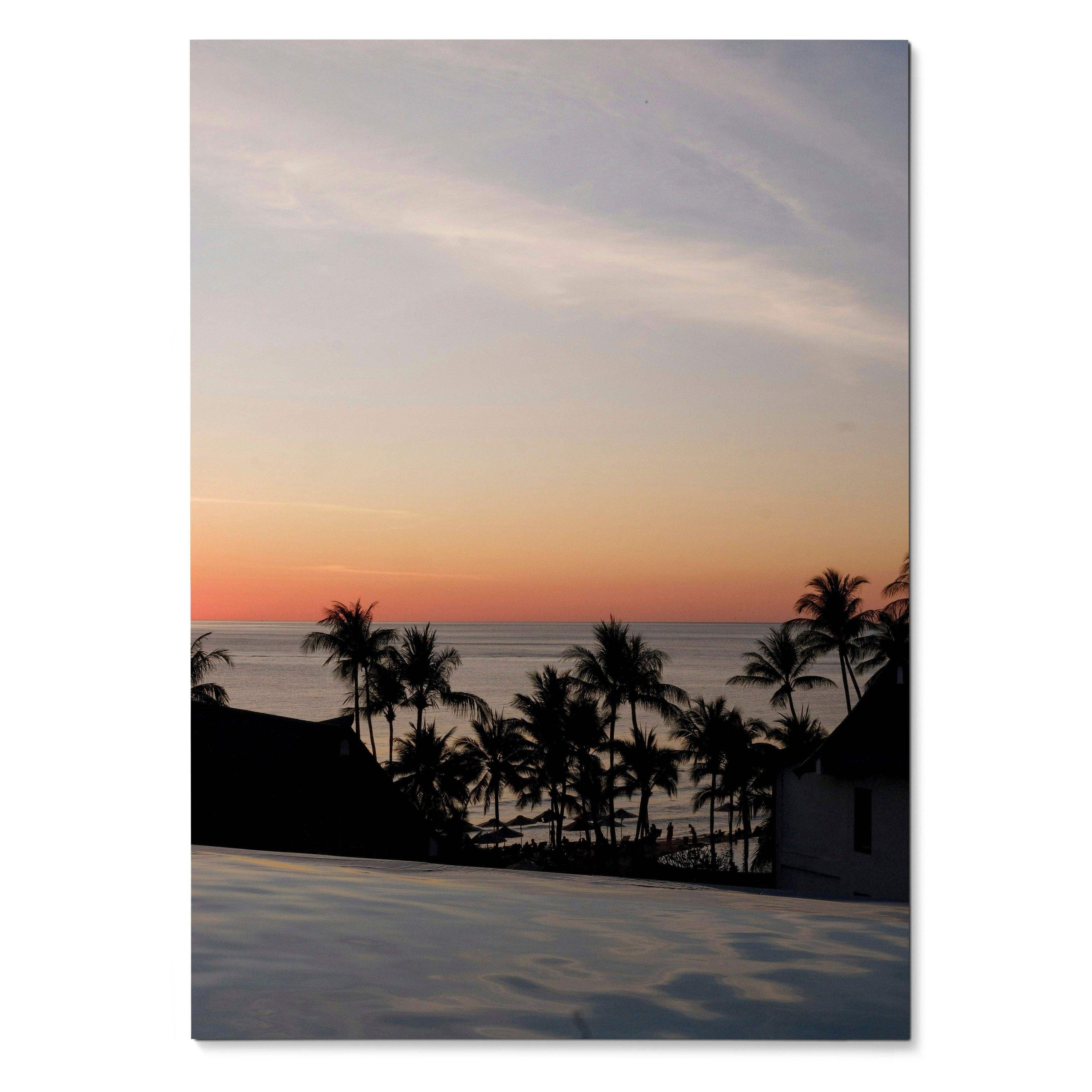 Serene beach sunset with silhouetted palm trees and calm ocean in vertical wall art poster.
