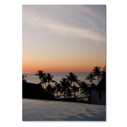 Serene beach sunset with silhouetted palm trees and calm ocean in vertical wall art poster.