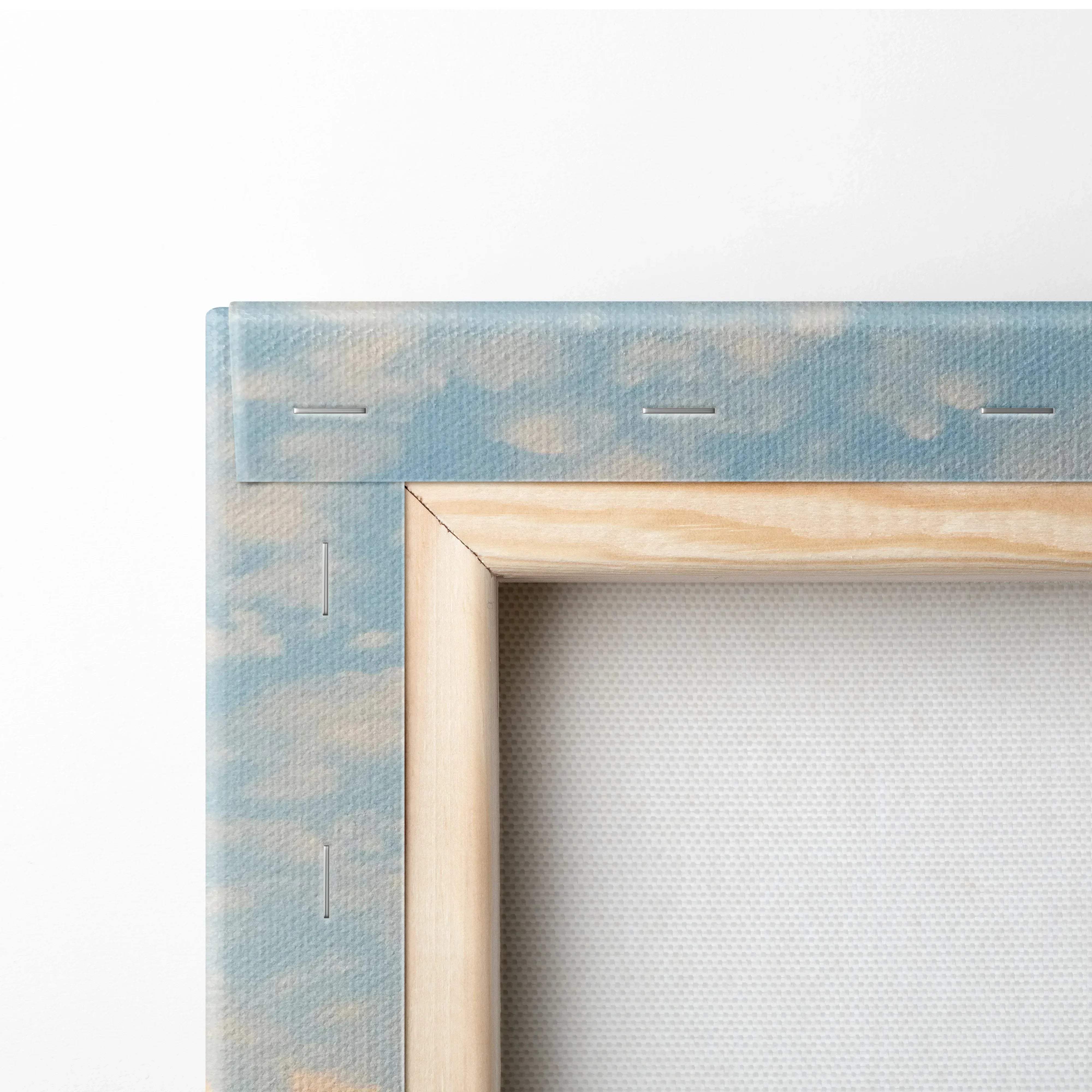 Light wood-framed canvas wall art with soft blue and beige sky design from serene seascape mountains at sunset