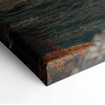 Close-up of canvas wall art print showing textured mountain and beach landscape with rich earthy tones.