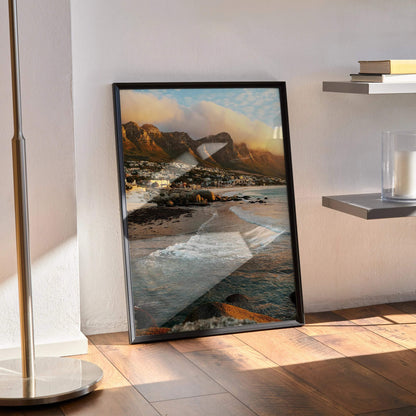 Vertical beach sunset poster with rocky shoreline and warm golden sky wall art.